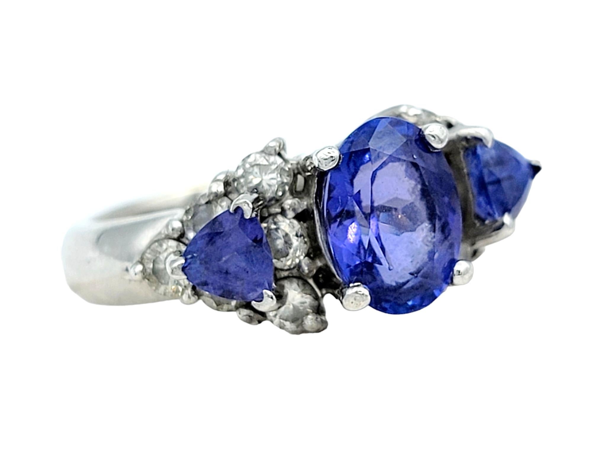 Ring Size: 6.75

This stunning Le Vian three stone ring is a magnificent creation set in lustrous 14 karat white gold. The focal point of the piece is a captivating oval blue tanzanite, exuding a deep and enchanting hue. Flanking either side of the