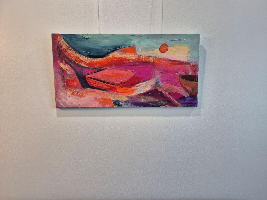 This abstract artwork vividly captures a surreal landscape through its dynamic use of color and form. The composition is dominated by sweeping curves and bold lines that create a sense of movement and depth. A vibrant palette of pinks, oranges, and