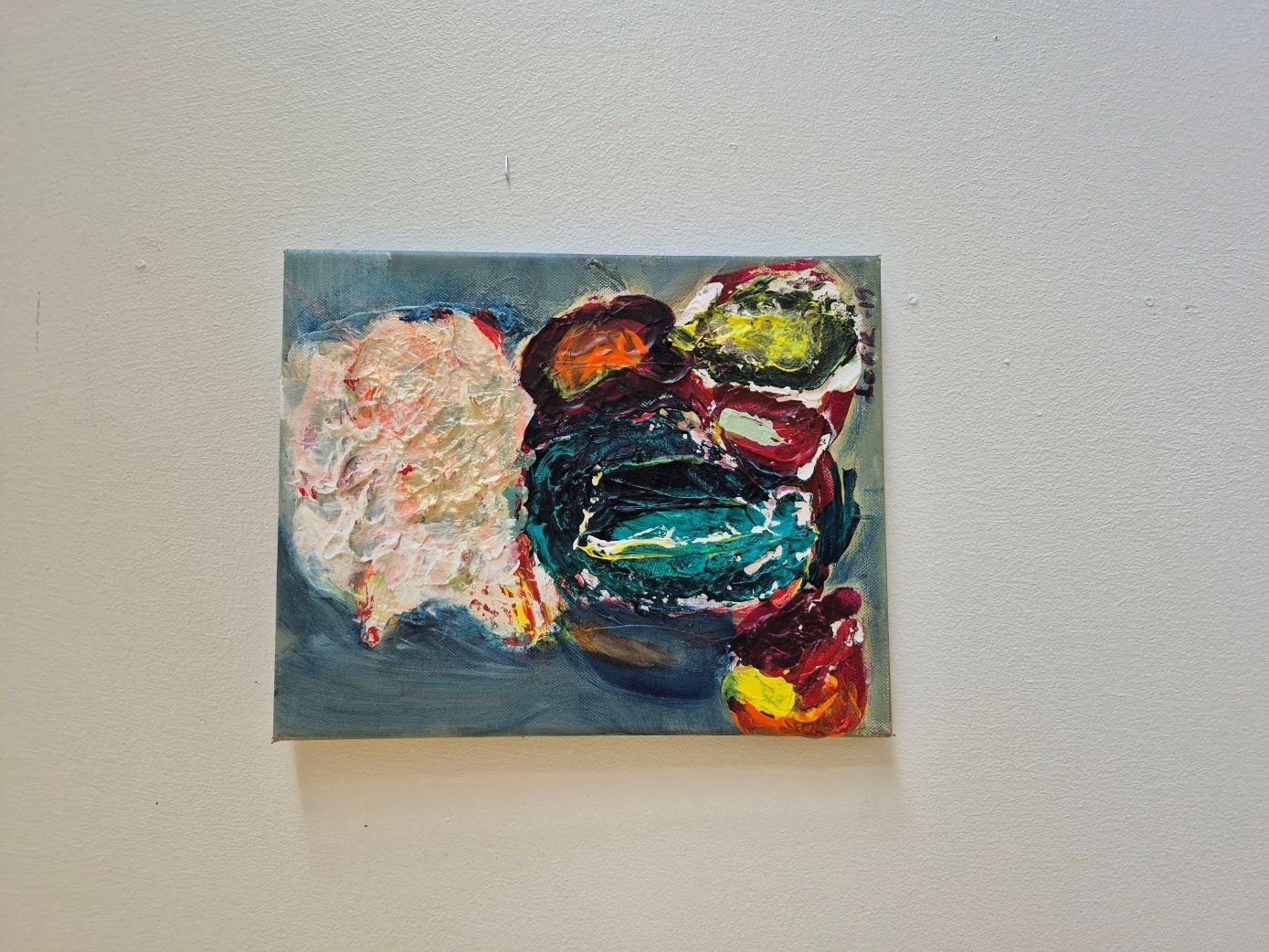 This artwork presents a vibrant and textured abstract composition, showcasing a dynamic blend of bold colors and intricate forms. Central to the piece is a robust amalgamation of deep greens, vivid reds, and dark purples, suggesting an enigmatic