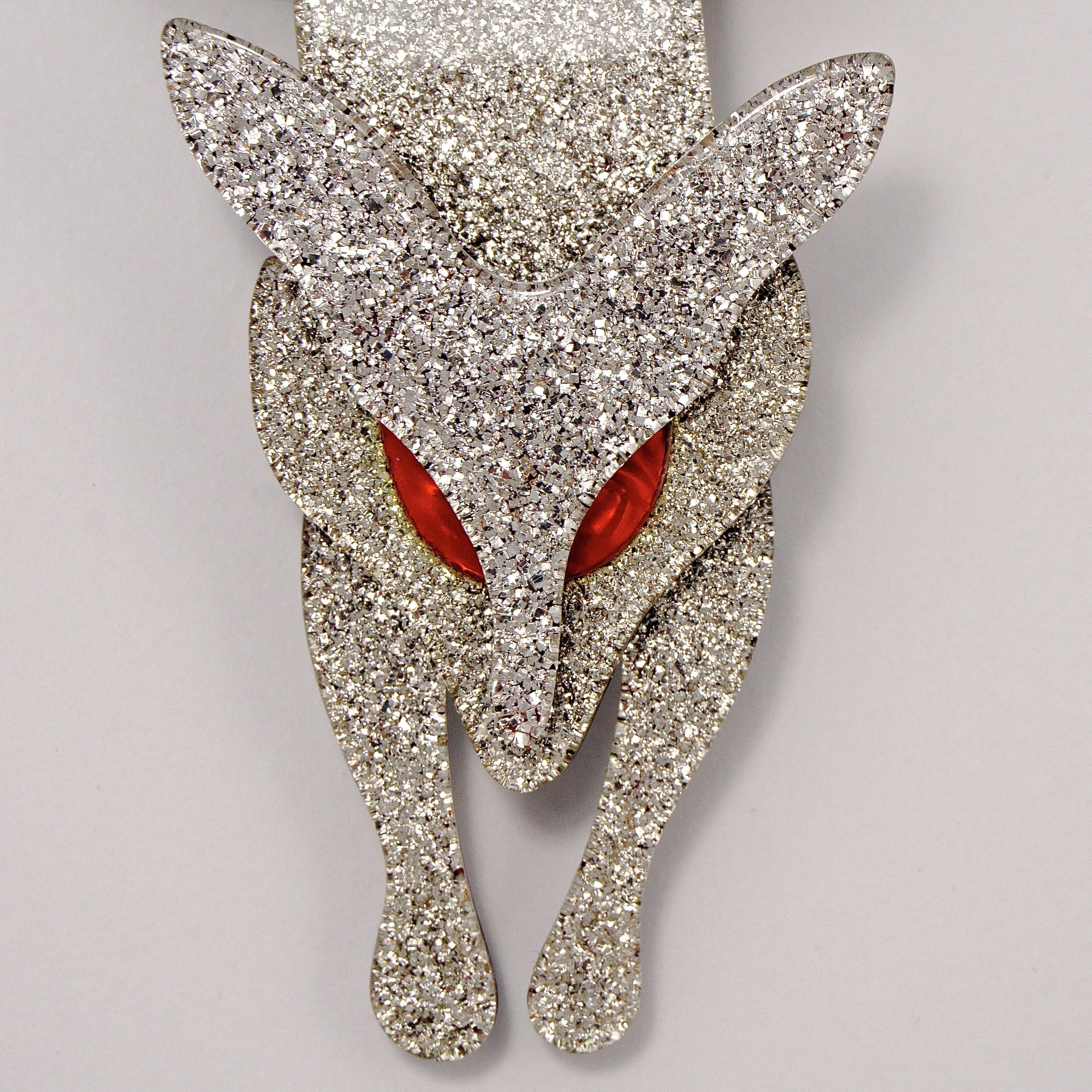 Lea Stein silver fox brooch with red eyes in very good condition, and featuring a wonderful sparkly design. The brooch is made from layered plastic, and measures length 9.2cm / 3.6 inches, by maximum width 6cm / 2.36 inches.

This is a beautiful