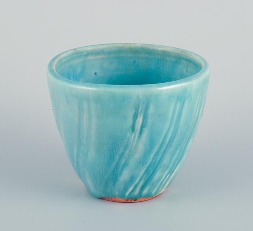 Lea von Mickwitz (1884 -1978) for Arabia, Finland. 
Unique ceramic bowl with turquoise glaze.
Mid-20th c.
In excellent condition with a hairline crack on the top. Please refer to photo.
Dimensions: Diameter 10.0 cm x Height 8.0 cm.
