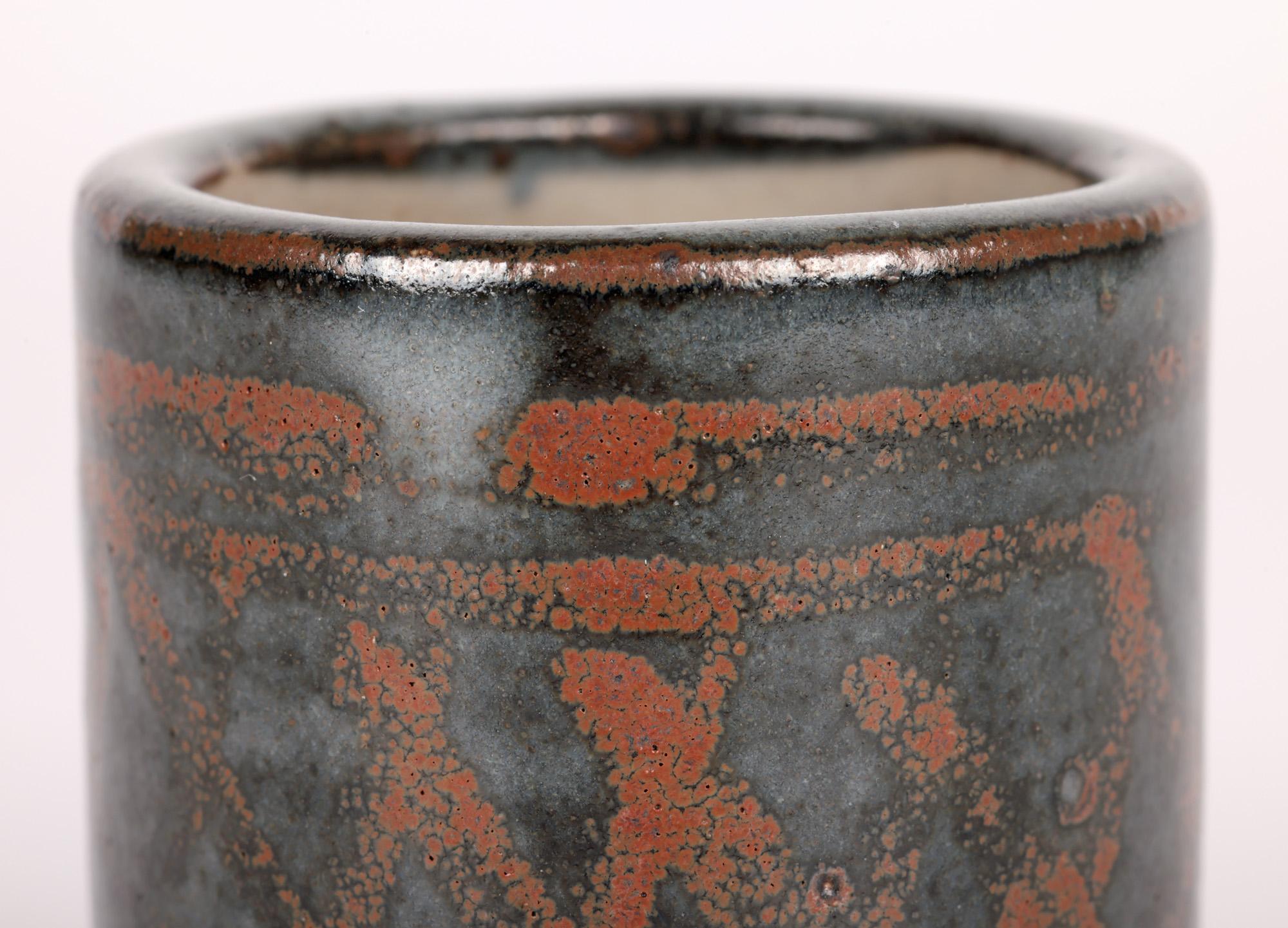 A stylish and delightful stoneware studio pottery brush pot decorated with a cross hatch design made at the Leach Pottery, St Ives around 1945. The heavily potted brush pot stands on a round unglazed base and is of simple cylindrical shape with a