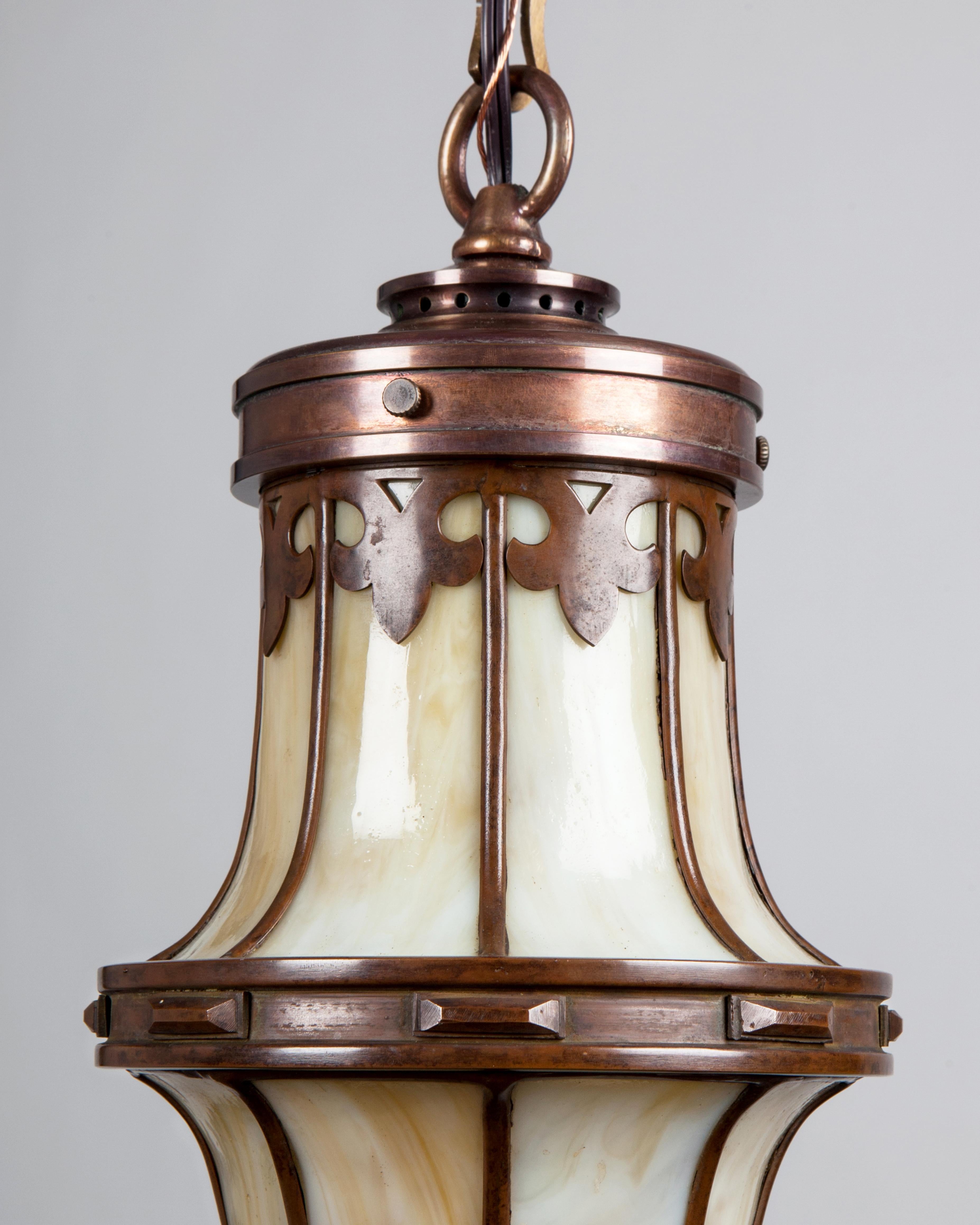 AHL3992
An Art and Crafts style antique leaded glass and coppered bronze lantern with a beautiful mossy brown patina. The fitter, chain and canopy were custom-made in the Remains Lighting Co. workshop. We attribute the body to either Tiffany Studios