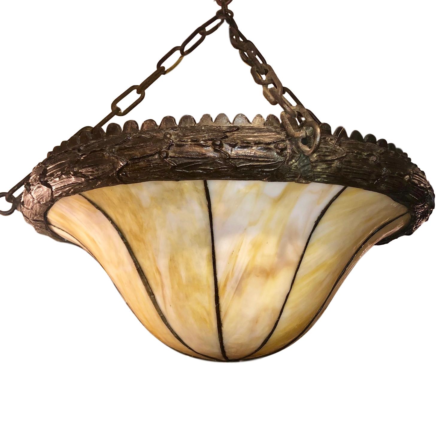A circa 1910 English leaded glass pendant light fixture with amber tones in the glass.

Measurements:
Minimum drop 24