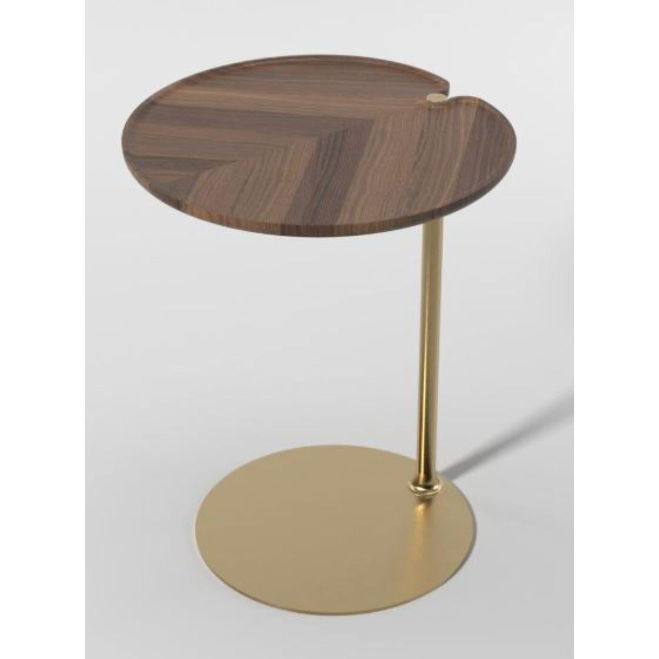 Leaf 1 round side table by Mathias De Ferm
Dimensions: D 42.5 x W 44 x H 55.5 cm
Materials: Walnut wood, brass.
Also available in different materials. 
 
LEAF-shaped walnut/oak tabletops revolve around a sleek brass base with a carefully