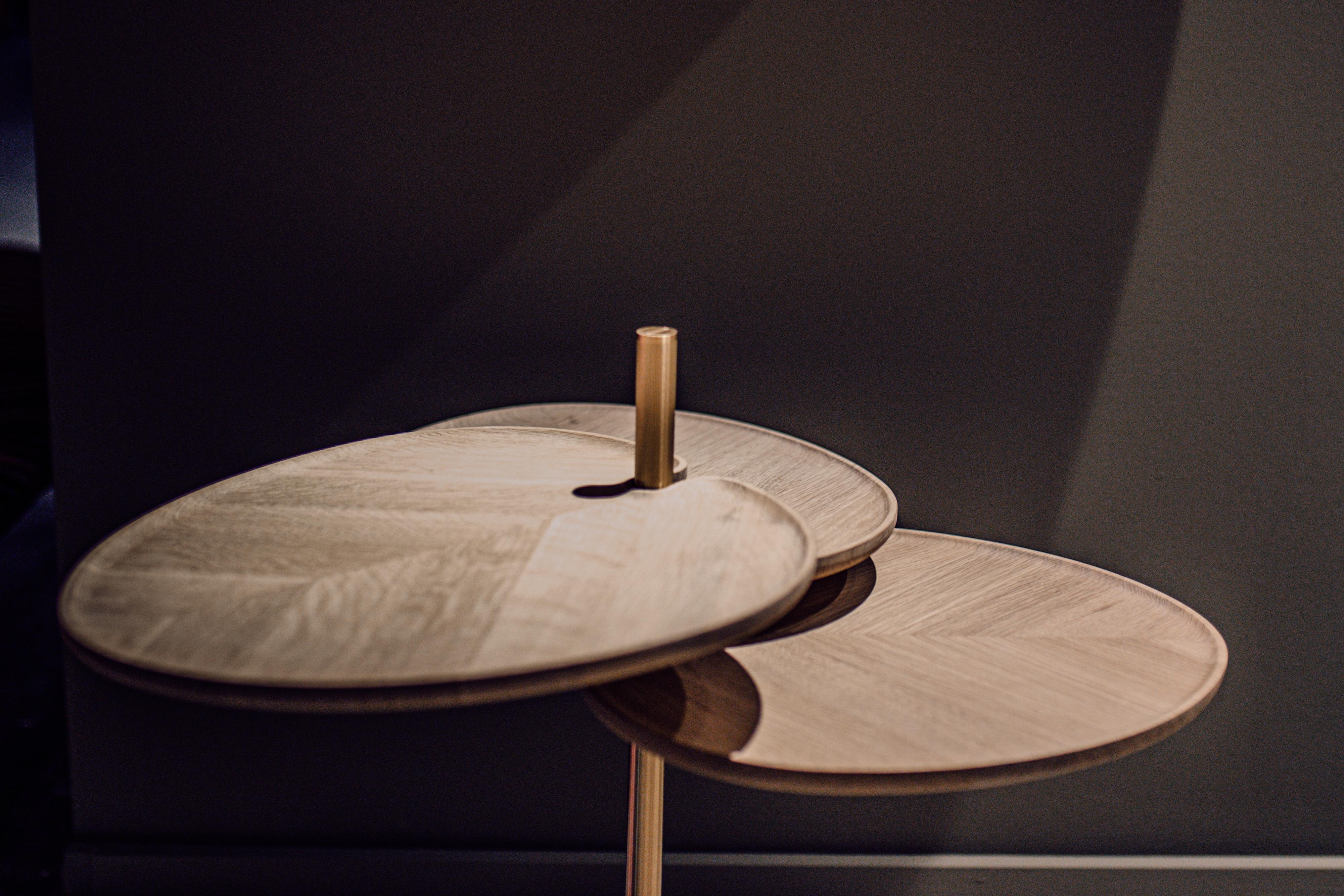 LEAF 3 Side Table 

LEAF is a collection of side tables featuring leaf-shaped walnut or oak tabletops atop a sleek brass base with a meticulously crafted handle. Available in two styles - LEAF-3 with three turnable discs and LEAF-1 with a