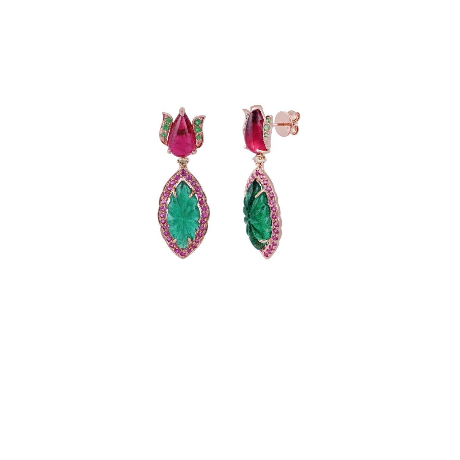 Leaf carved Emeralds 10.10 carats, adorned by 1.06 carats of round Pink Sapphires on sides; crowned by lotus motif with Pear shaped cabochon Rubellite tourmalines weighing 5.70 carats with 0.29 carat of Tsavorite on sides; round Yellow Diamonds 0.09