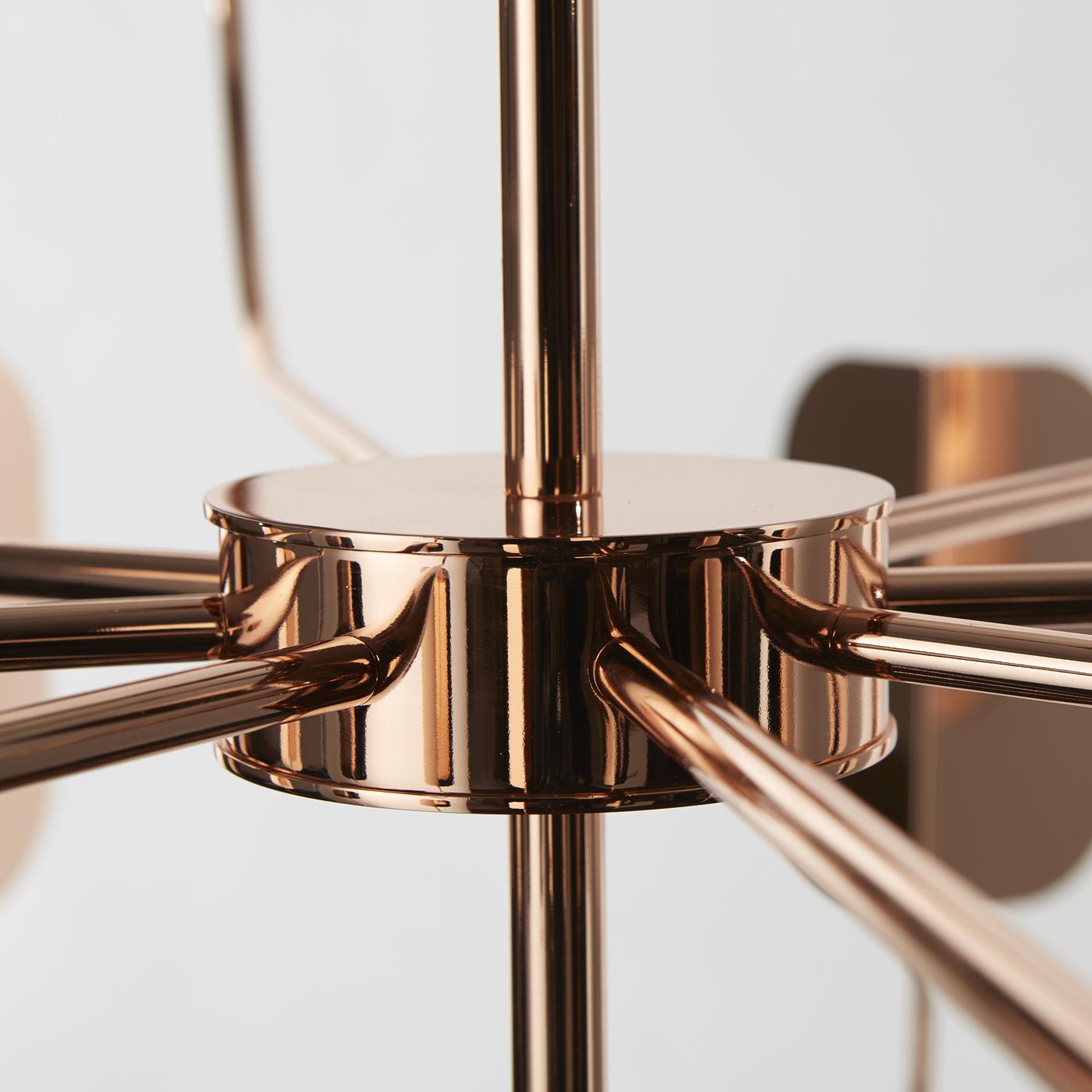 This striking twelve LED lights chandelier in two tiers has a delicate structure in hand forged iron with a polished copper finish and was designed by Matteo Zorzenoni. Its timeless look makes this piece versatile and adaptable to a Classic decor