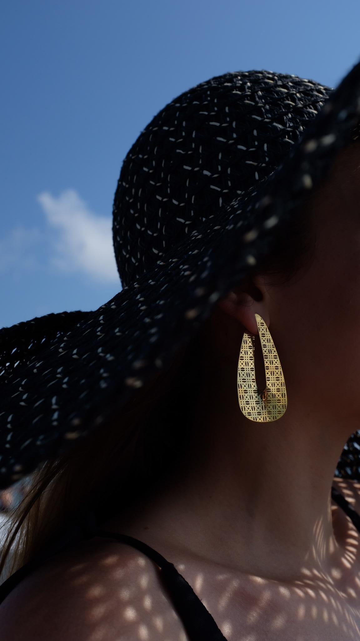 Leaf Earrings are handcrafted from 24ct gold plated bronze. 

This Seven Worlds piece is inspired by the ornaments of the incredible 9th-century Tatev Monastery located in southeastern Armenia. It is said that the master who built the Tatev