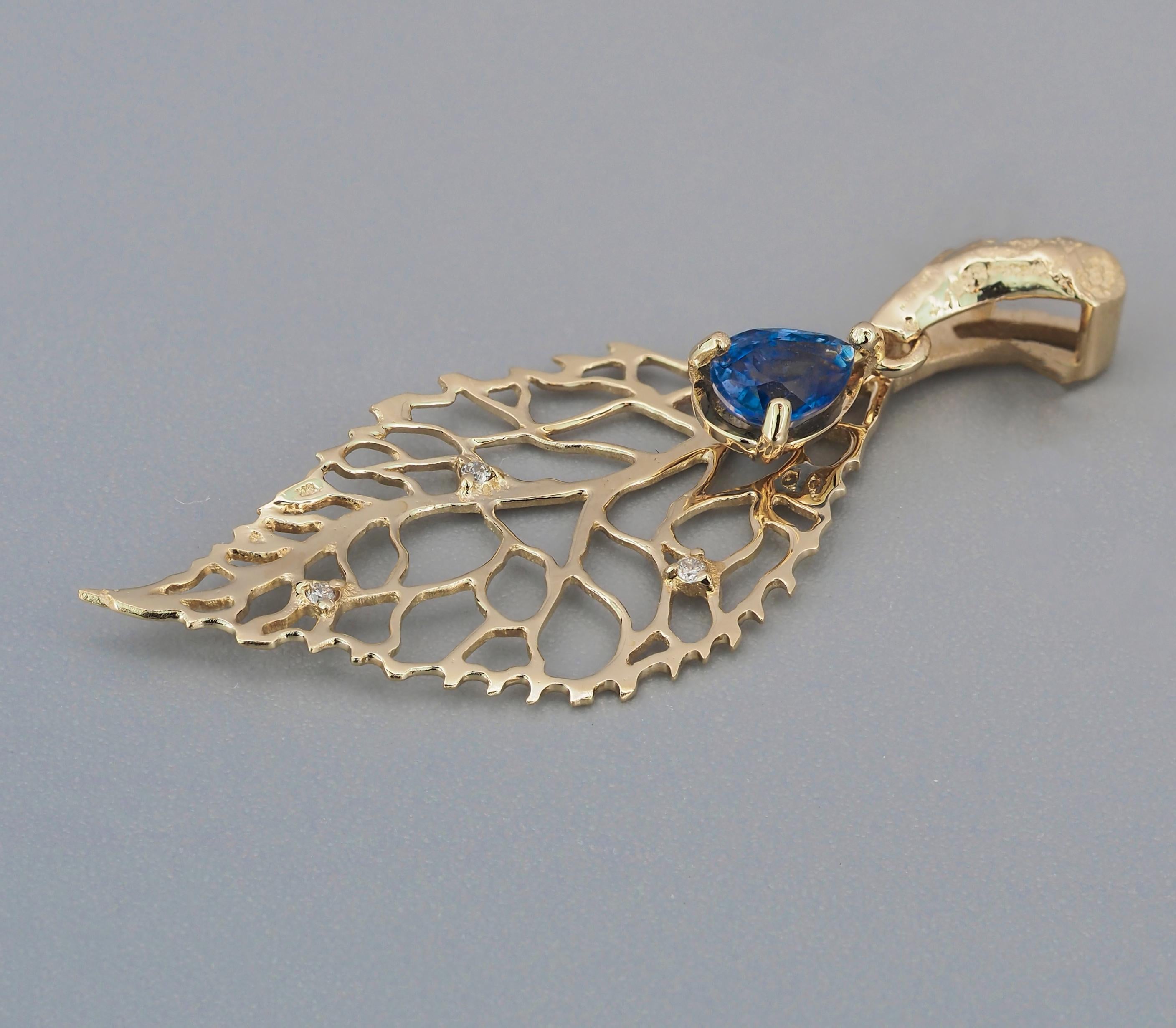Leaf pendant with sapphire, diamonds. 
14k gold leaf pendant. Pear sapphire pendant. Blue sapphire pendant. Small Leaf, Mini Charm Necklace.

Metal: 14k gold
Weight: 1.2 g.
Pendant size in mm - 37х14.86 mm.

Central stone: sapphire
Cut: pear
Weight: