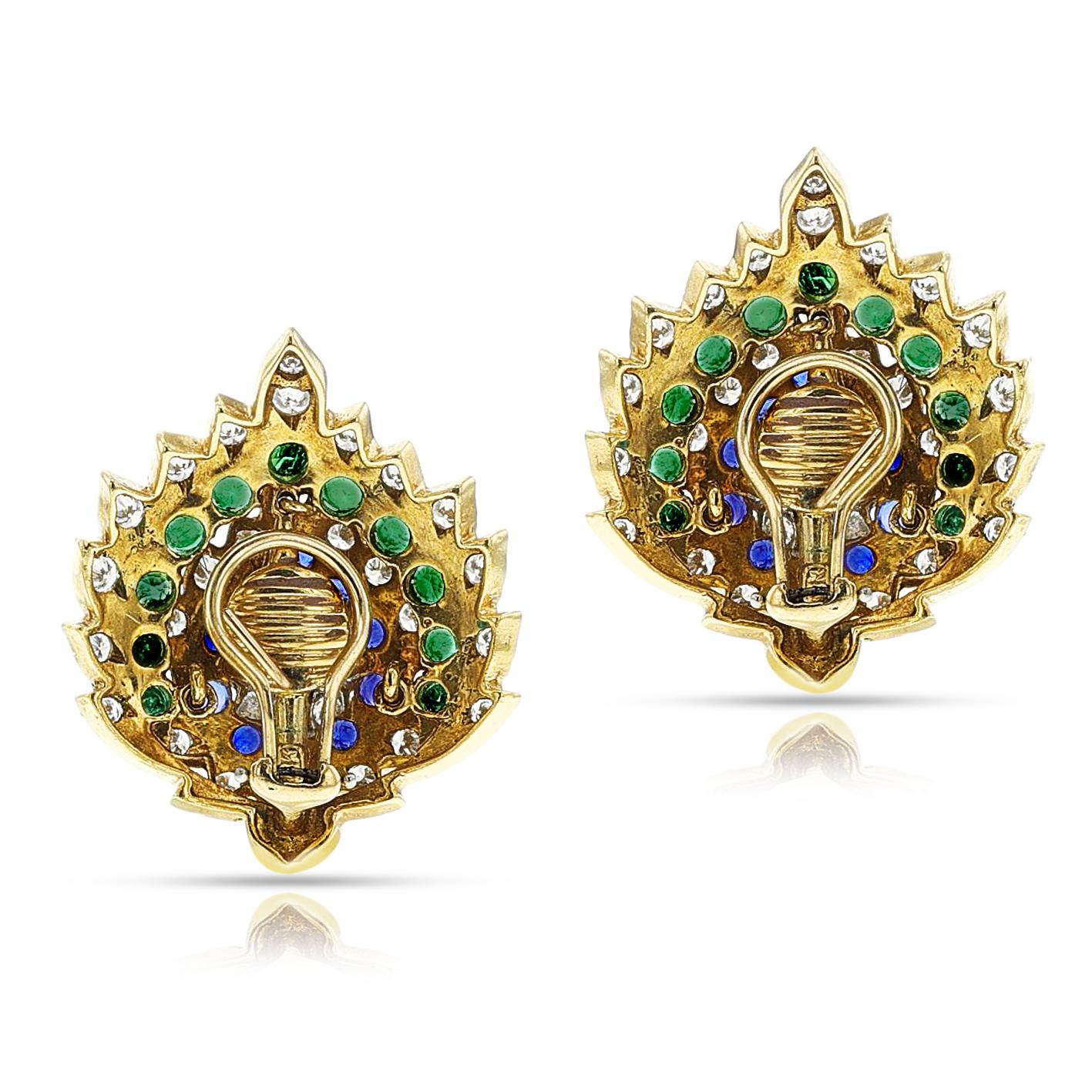A pair of Leaf-Shape Diamond, Sapphire, and Emerald Cocktail earrings made in 18k yellow gold. The diamonds weigh 4.3 carats and color/clarity is F, VS. The earrings weigh 31.69 grams. The length is 3.5 cm x width 2.5 cm. 