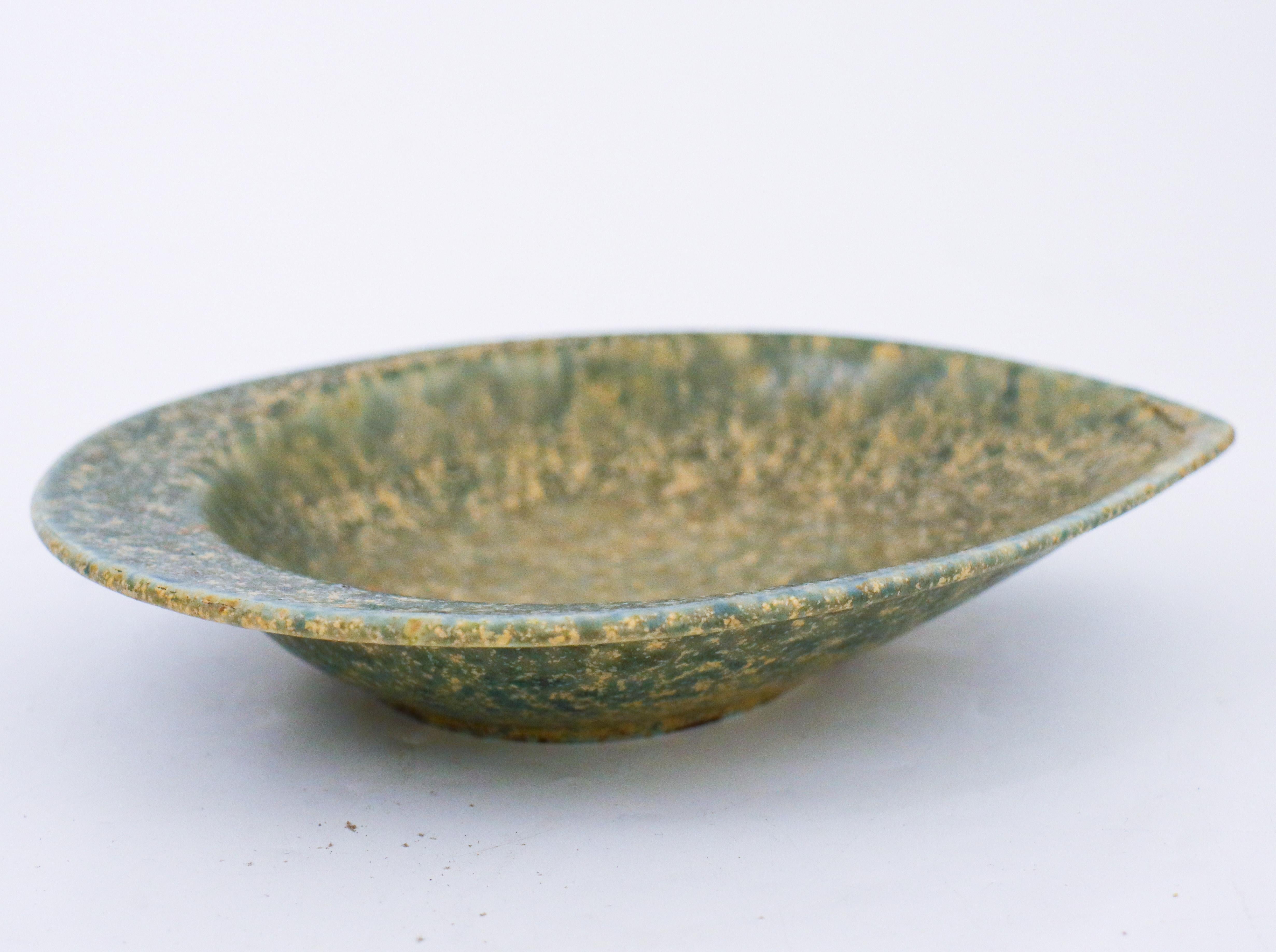 A leaf-shaped dish with a stunning glaze designed by Carl-Harry Stålhane at Rörstrand The bowl is 20,5 x16 cm (8,2