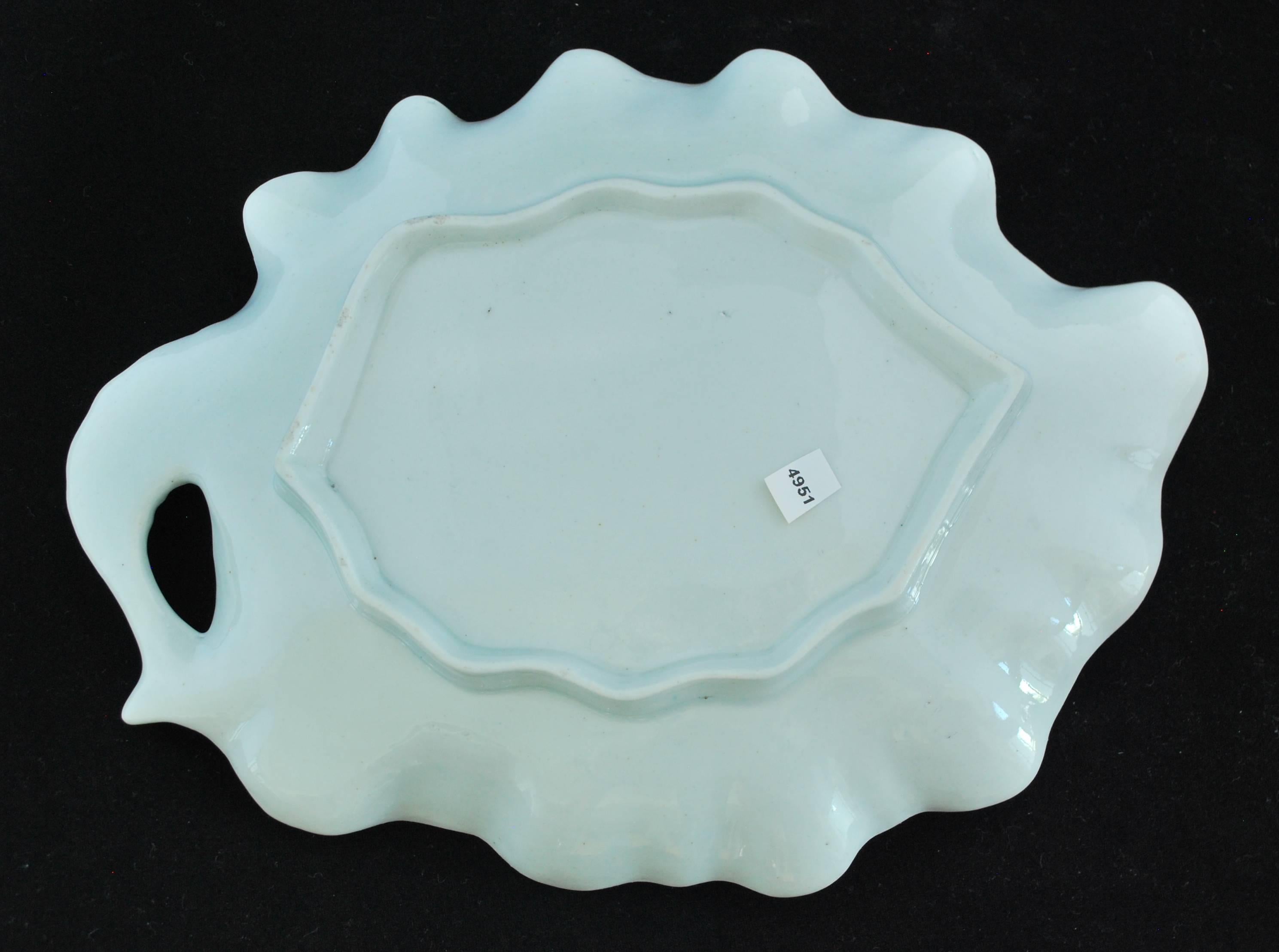 An attractive leaf-shaped dish with floral decoration, probably done in the Giles workshop.