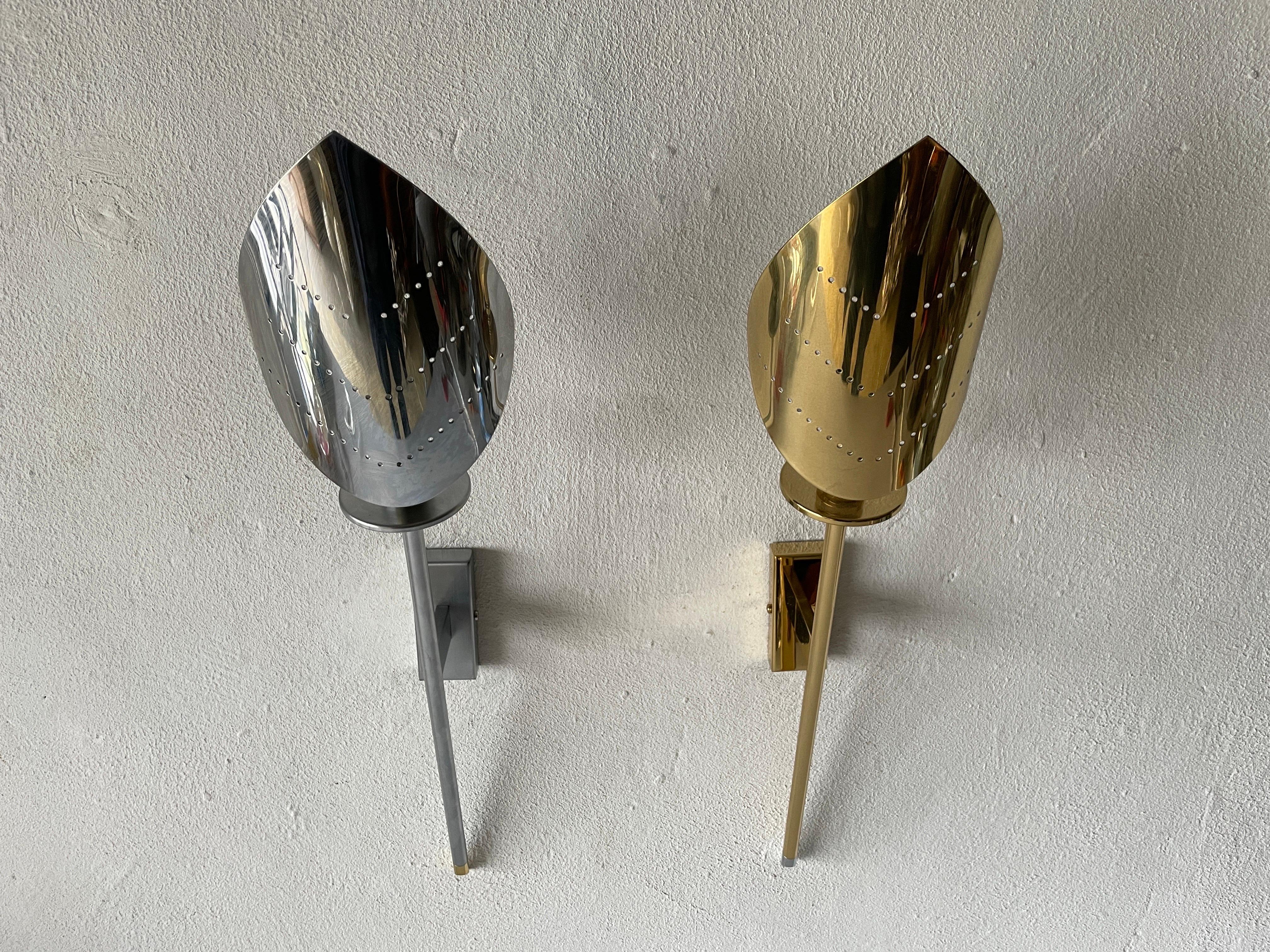 Leaf Shaped Gold and Chrome Pair of Sconces by Baulmann Leuchten, 1980s, Germany

Very nice high quality wall lamps.

Lamps are in very good vintage condition.

These lamps works with E14 standard light bulbs. 
Wired and suitable to use in
