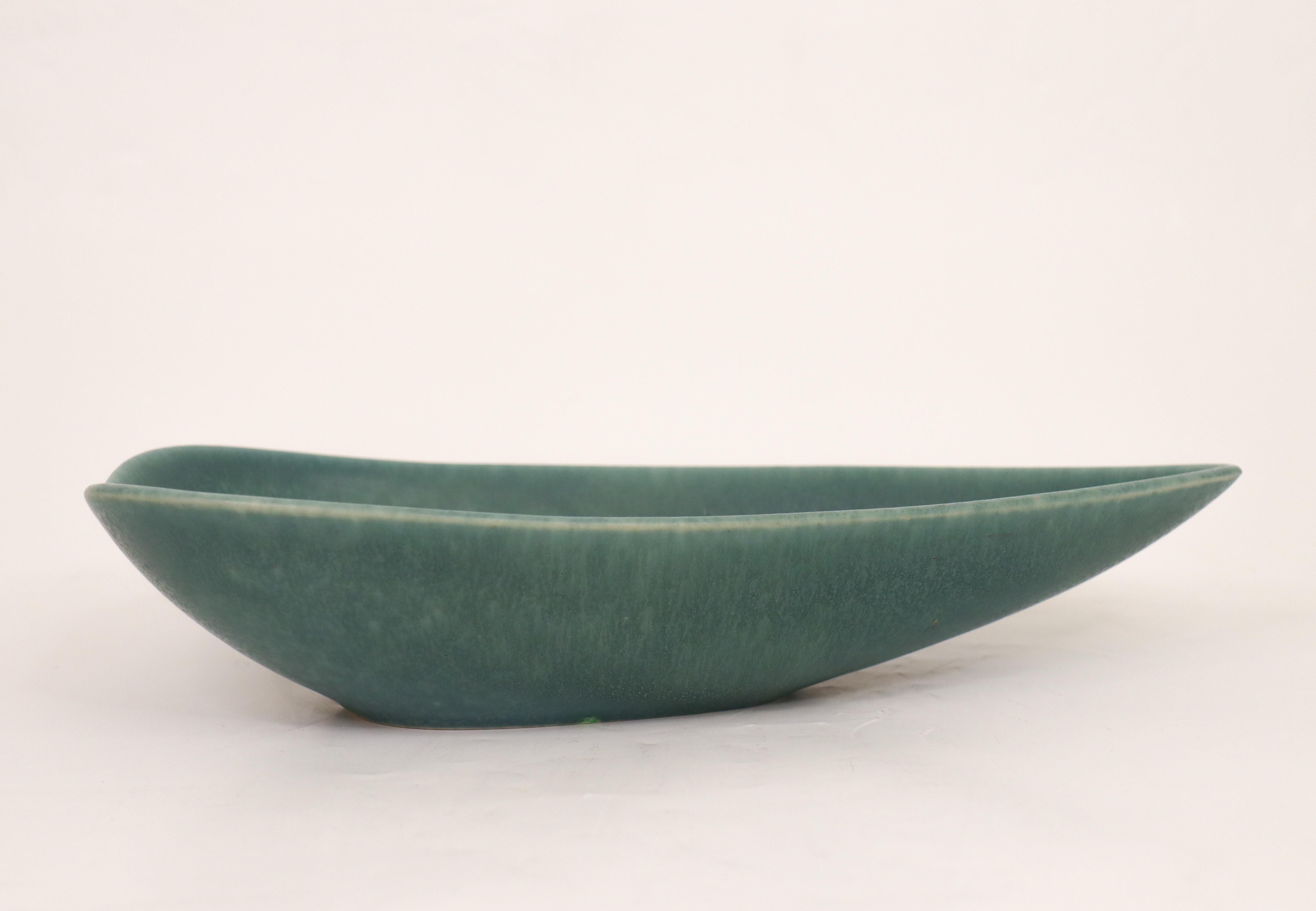 A leaf-shaped, green bowl designed by Gunnar Nylund at Rörstrand, the bowl is 28,5 x 13 cm (11.4