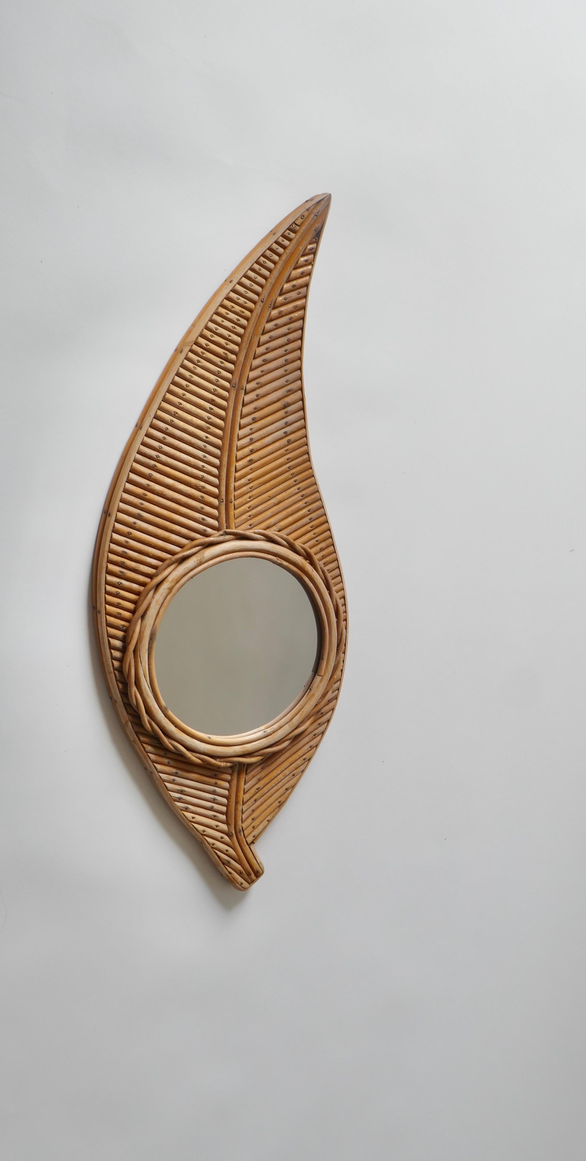 A unique Leaf shaped mirror 

Rattan, Glass
France 1970s.