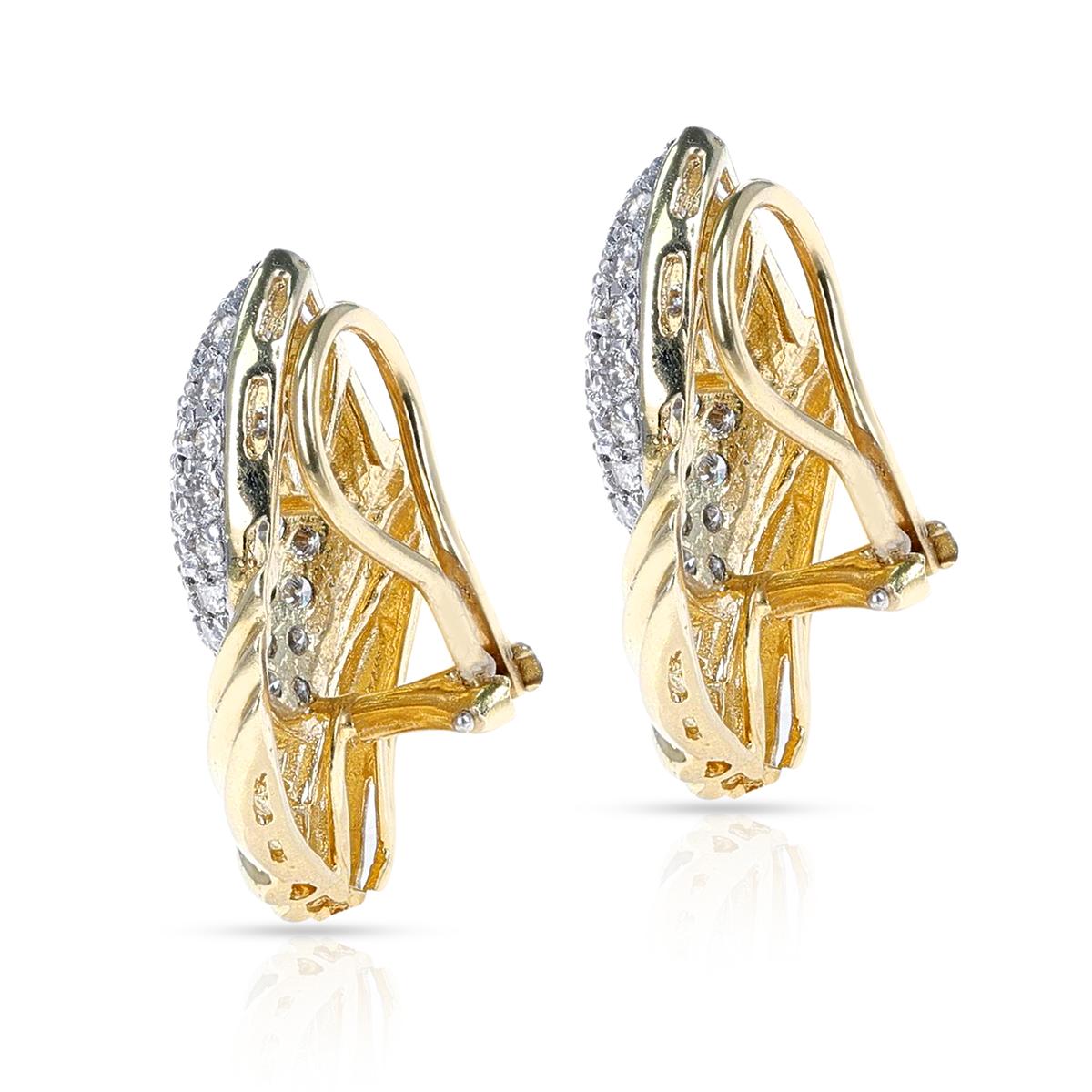 A beautiful pair of leaf-style diamond cocktail earrings made in 18 Karat Yellow Gold. The length of the earring is 1.20.