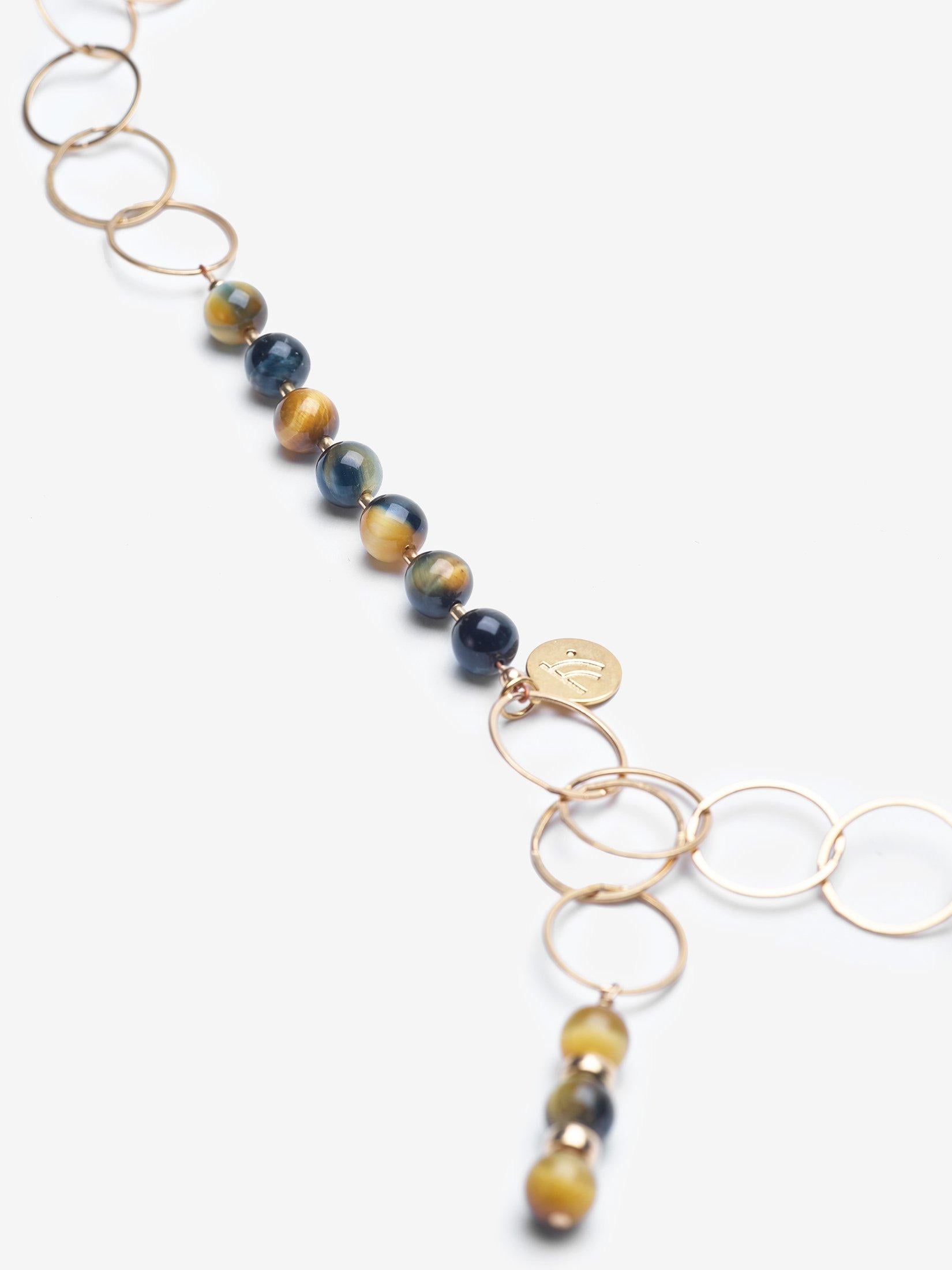 Story Behind the Jewelry
Chosen is one our initial premier necklaces and its name is very fitting as it a top seller.  The 14K gold chain is adorned with a natural leaf pendant with a patina finish and accented with yellow midnight blue tiger's