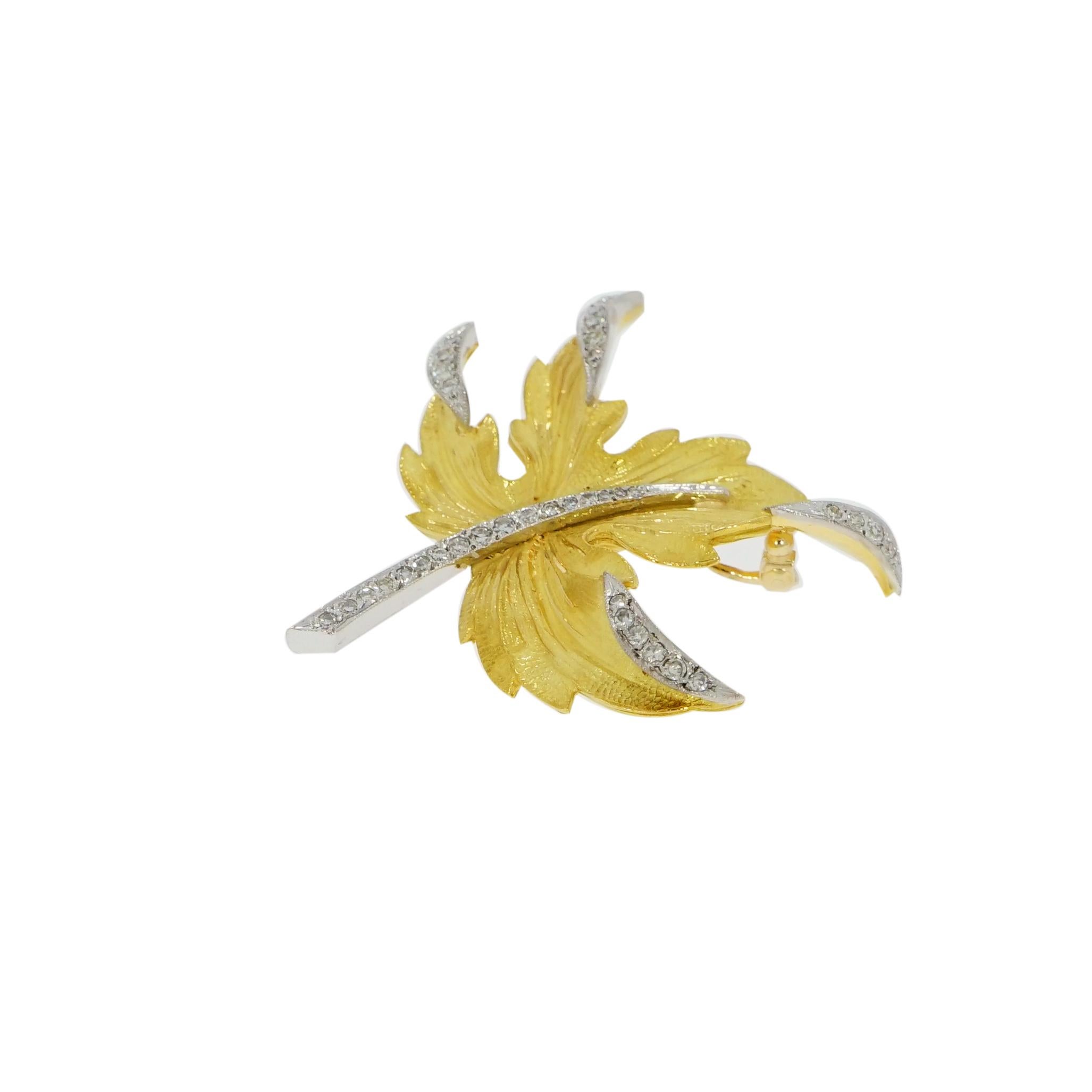 This Nature inspired 18K Yellow Gold and Diamond Leaf Brooch is absolutely gorgeous!!
Handcrafted in 18K yellow gold with a matte and high polished finishes. The stem is highlighted in white gold and accented with 36 single cut diamonds as the