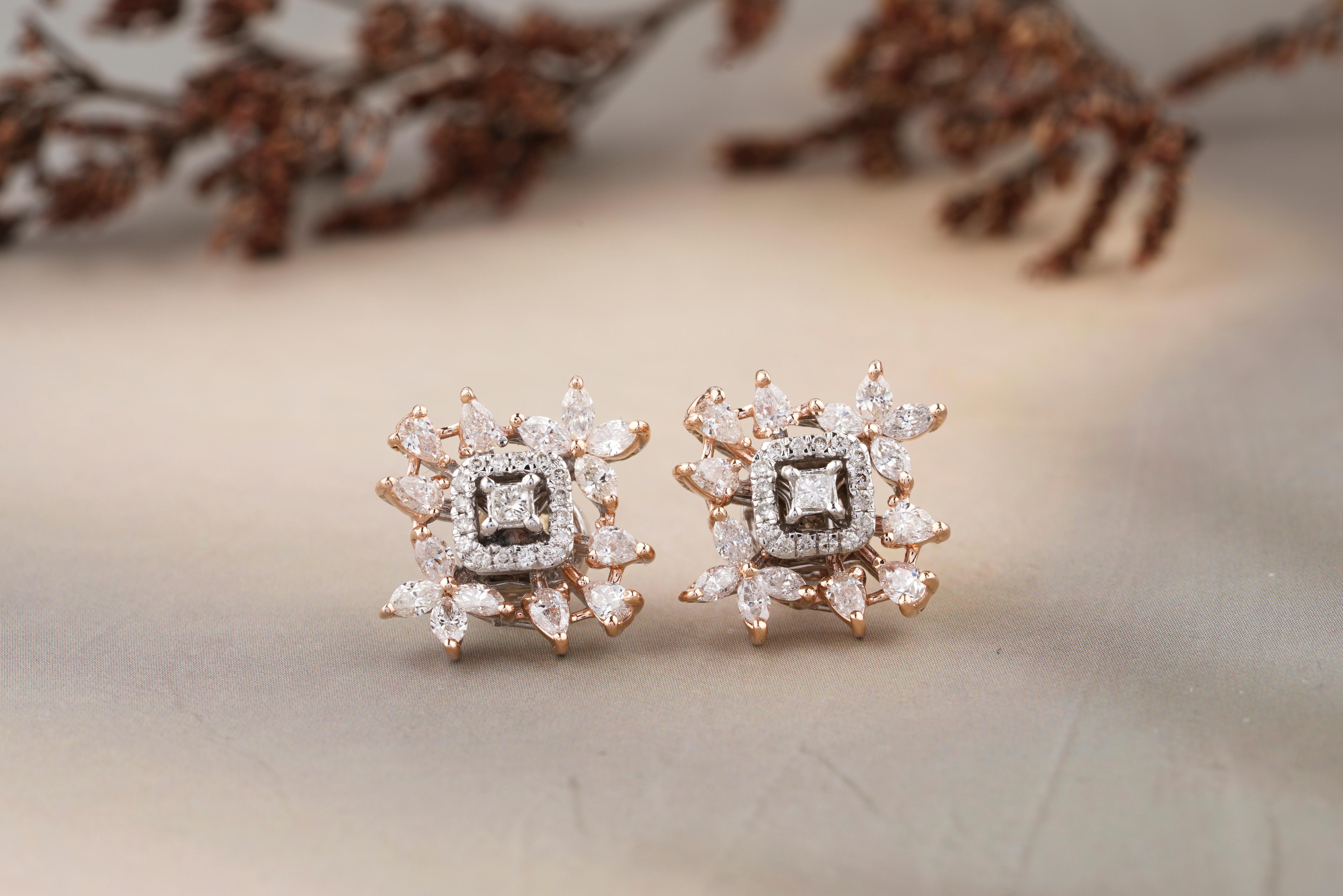 Leaflet Design Stud Fancy Diamond Earrings feature a central square-cut diamond (princess cut) encased in a halo of smaller round-cut diamonds. This central motif is further embellished with a sunburst-like arrangement of marquise-cut & pear-cut
