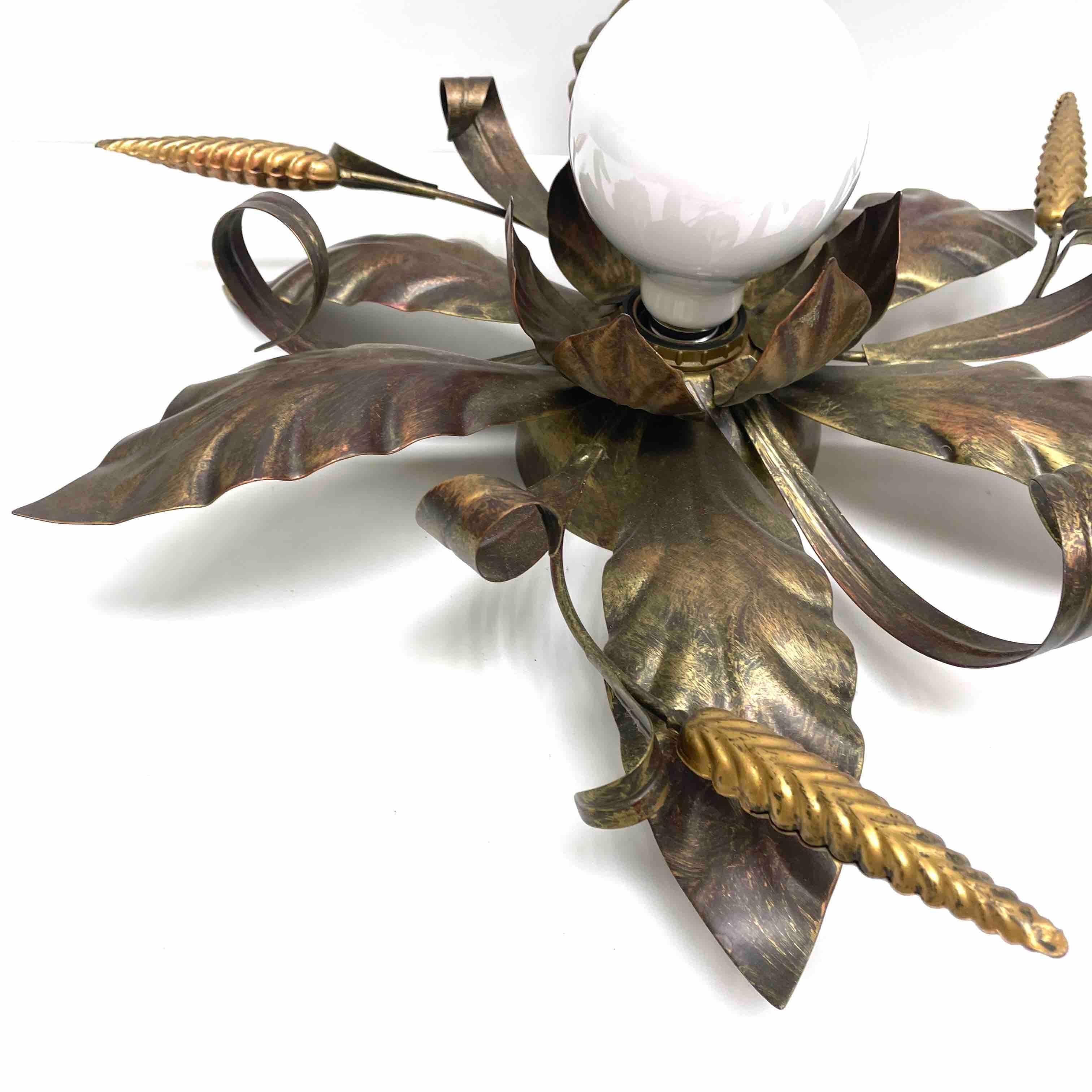 Add a touch of opulence to your home with this charming flush mount. Perfect eroded copper and gilded colored leafs and wheat sheafs to enhance any chic or eclectic home. We'd love to see it hanging in an entryway as a charming welcome home. Built