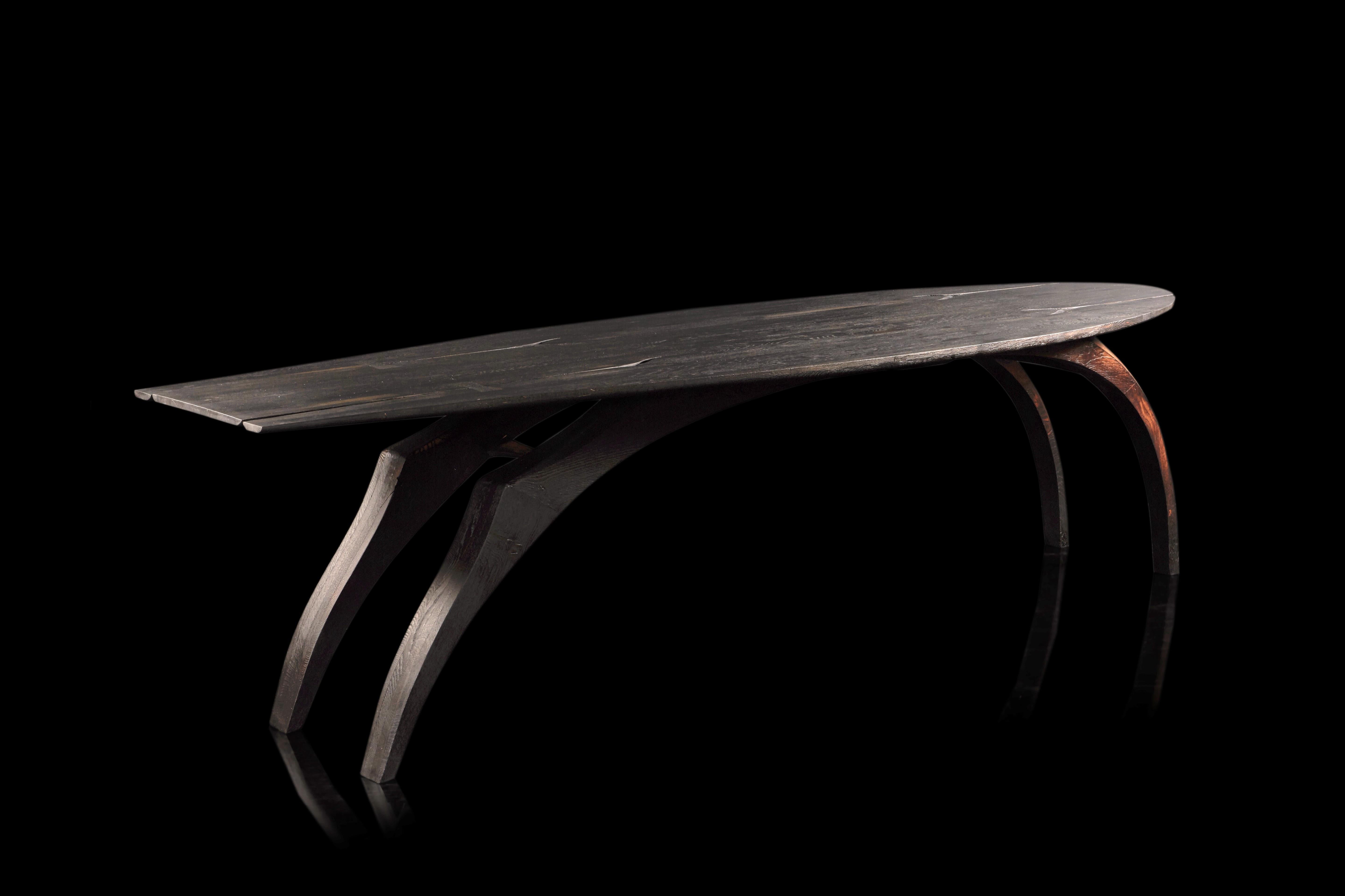 The Leap table was completed in 2019.
The design suggests the fluid figure of an animal in motion.
– Made from English oak with an ebonised top.
– The legs are brushed to enhance the grain and flame-scorched.
– Finished with protective hard wax