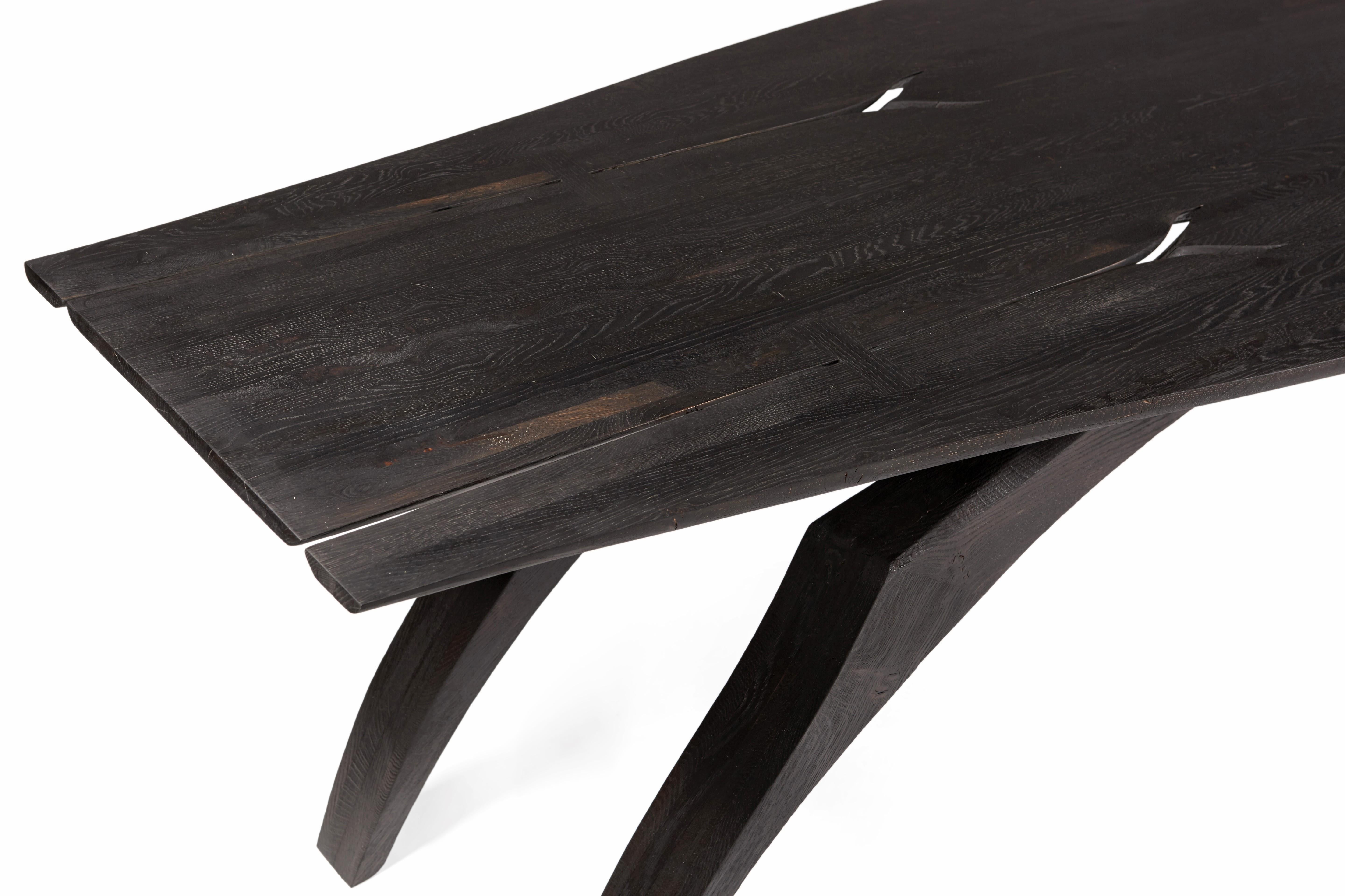 English 'Leap' table by Jonathan Field. Scorched legs & ebonized top. 