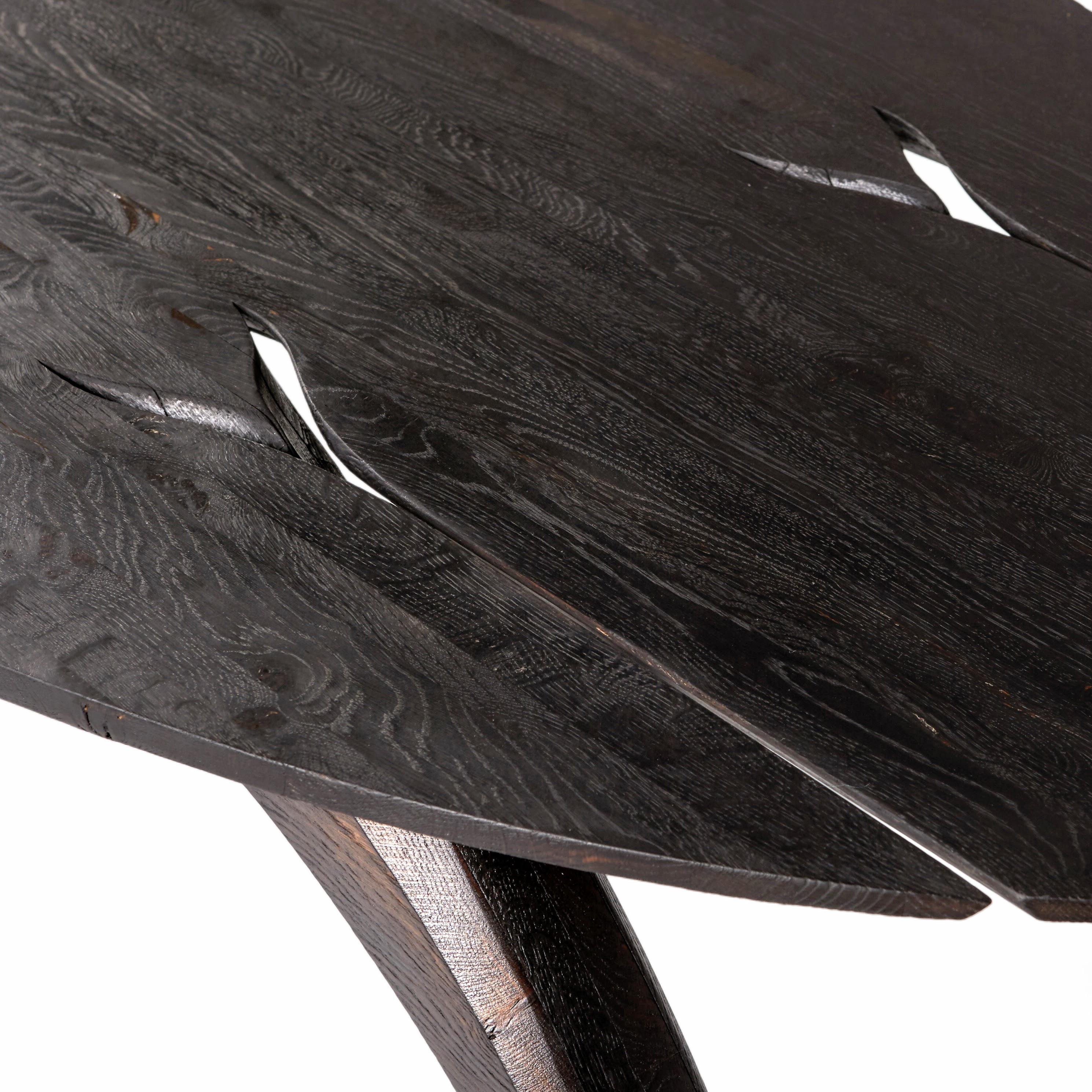 Ebonized 'Leap' table by Jonathan Field. Scorched legs & ebonized top. 
