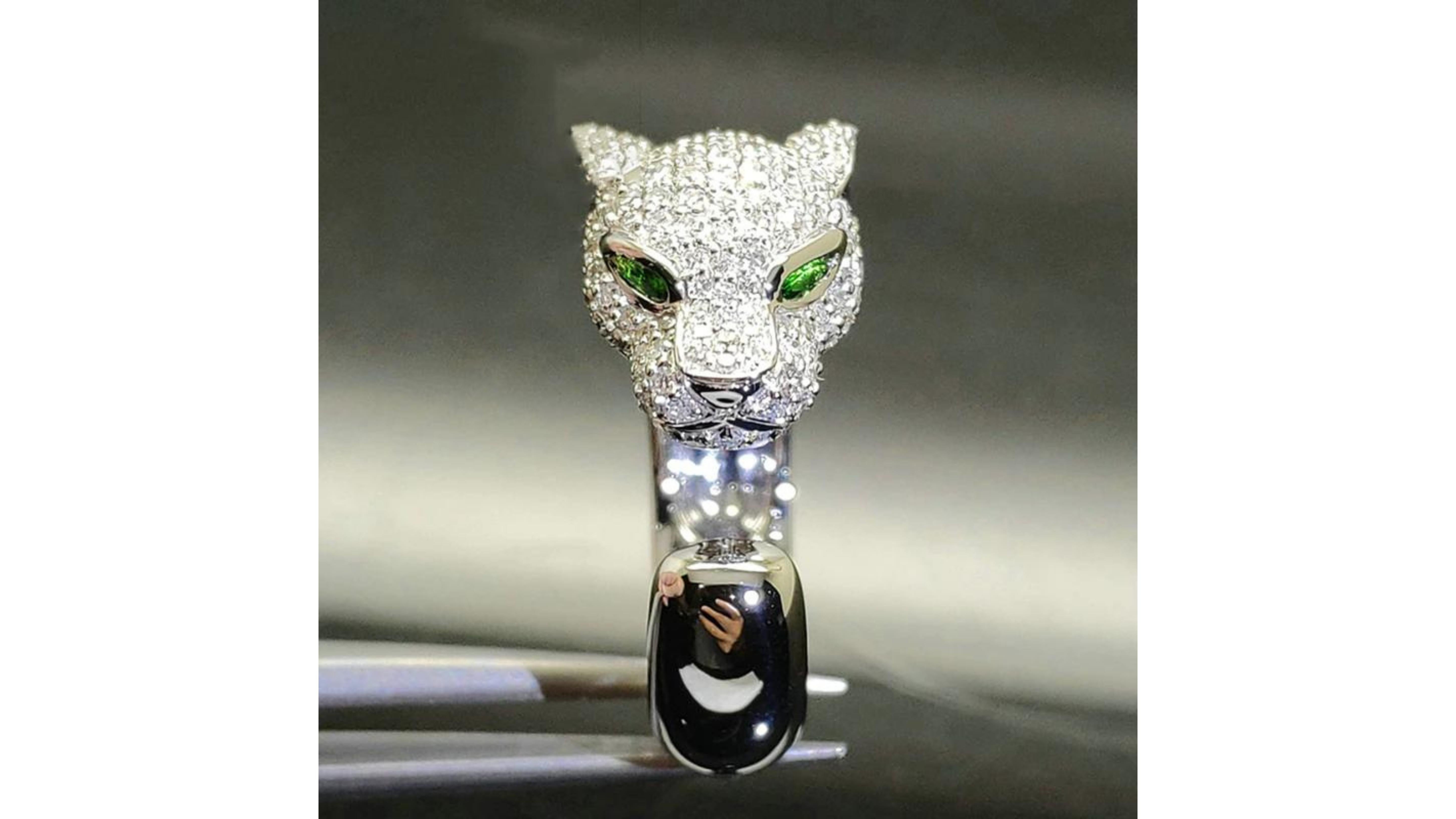 Leaped head Tsavorite Diamond Ring 18 Karat white Gold  . With eyes in Tsavorite it really does catch your attention and also note the ears and nose in the detail.  It can be in Rose and Yellow Gold too. Rounds Diamonds are on the head too.    If
