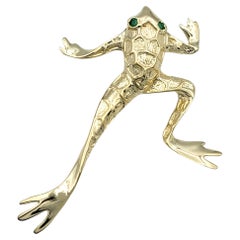 Leaping Frog Pendant with Emerald Eyes Set in Polished 14 Karat Yellow Gold