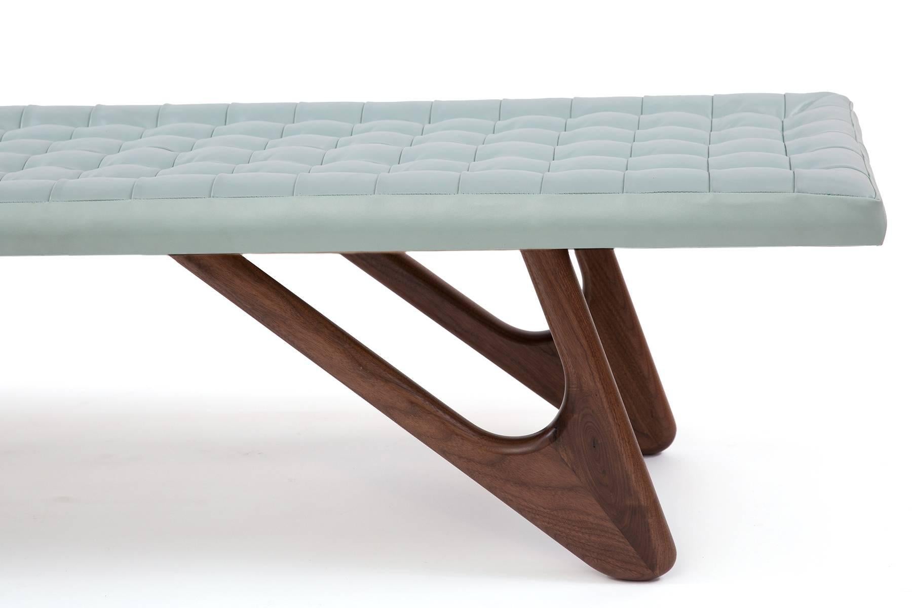 Leather and sculpted walnut bench made by Red Modern Furniture. We can make these to your specs with fabric or leather.