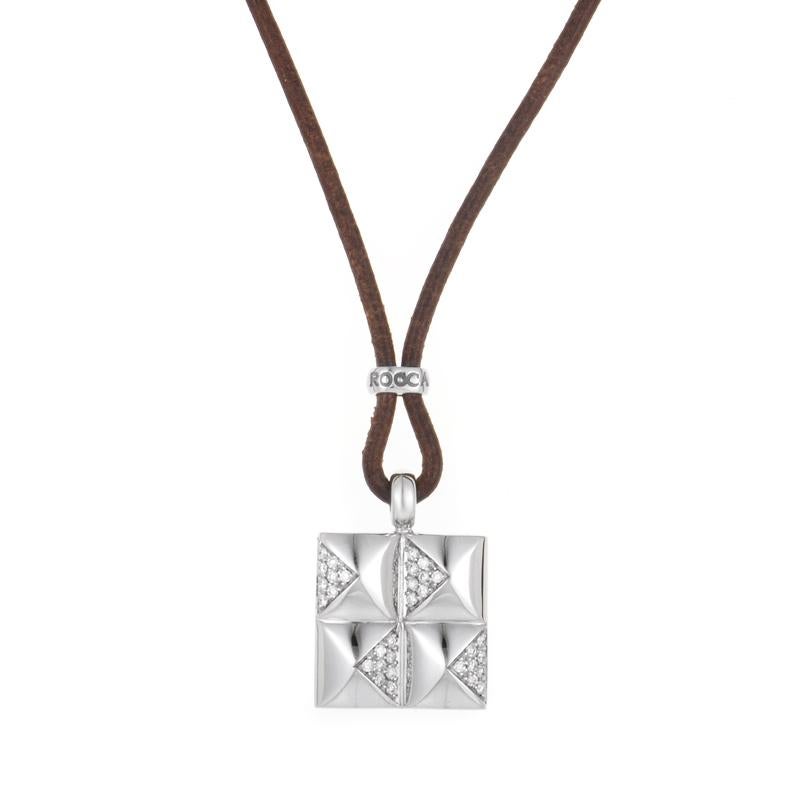 This pendant necklace is exceptionally luxurious, but has a design that is perfect for everyday wear. The necklace is a brown, leather cord from which hangs an 18K white gold pendant set with glittering white diamonds.