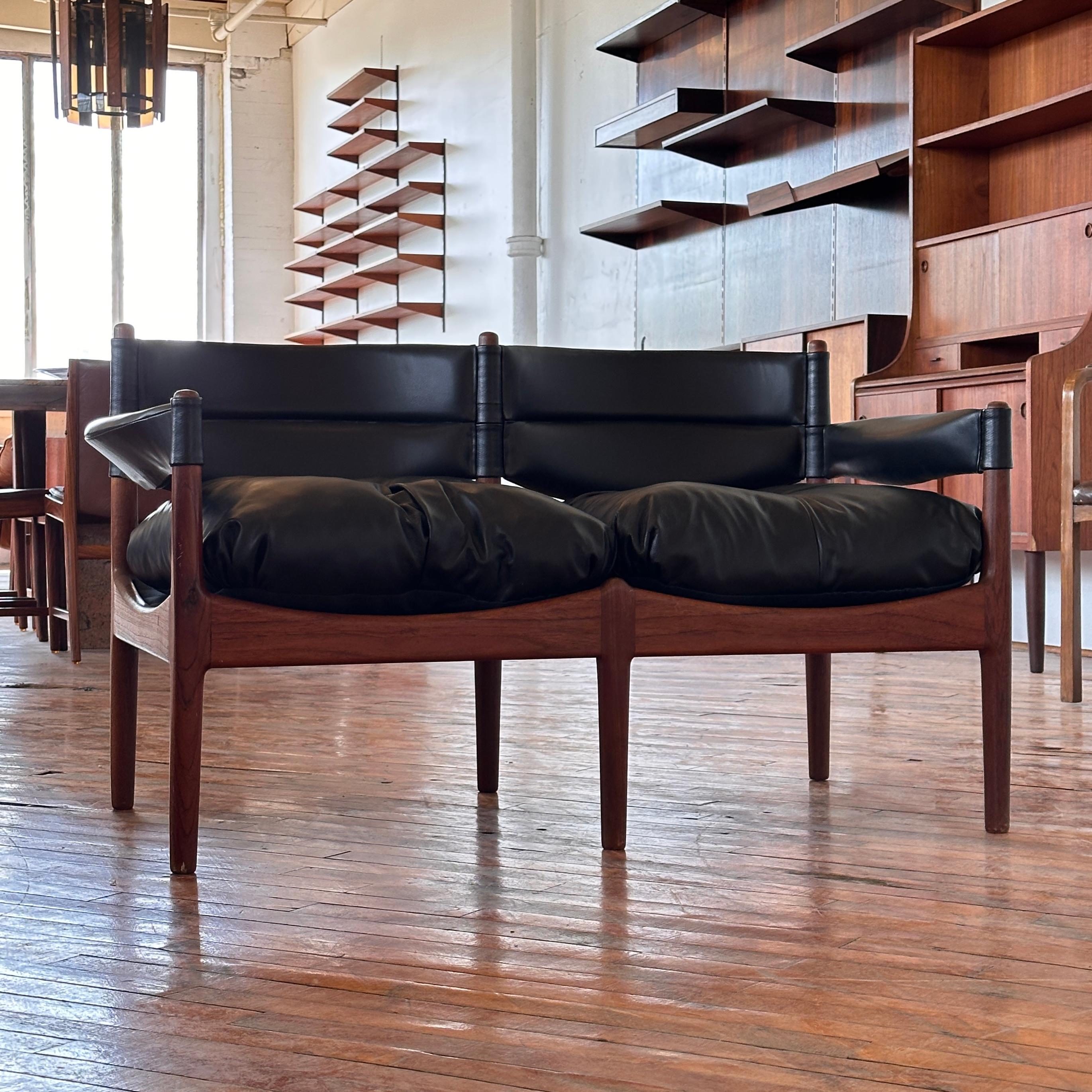 A striking testament to mid-century Scandinavian design, this Kristian Vedel MODUS loveseat is a rare and highly sought-after piece that embodies the perfect harmony of form and function. Designed by the visionary Danish architect and industrial