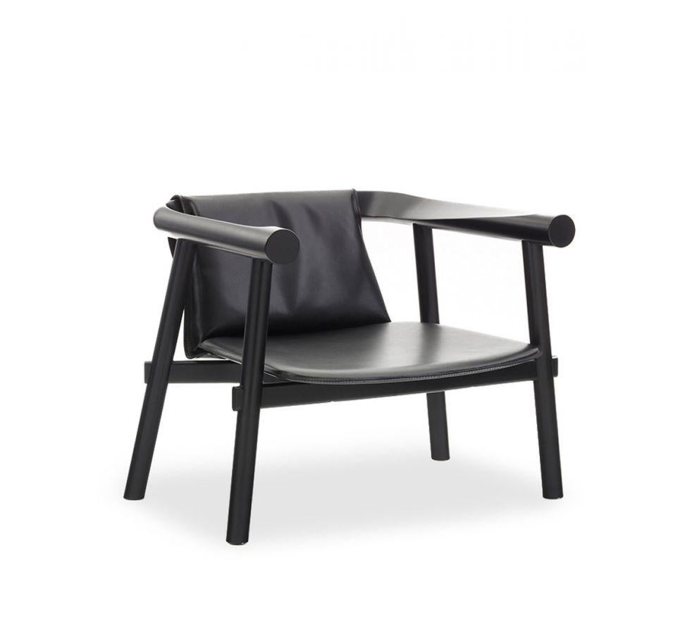 Leather altay armchair by Patricia Urquiola
Materials: Black lacquered solid beech structure. Seat covered in full-grain black leather.
Technique: Lacquered and stained wood. Upholstered in leather. 
Dimensions: D 73 x W 73 x H 63 cm
Available