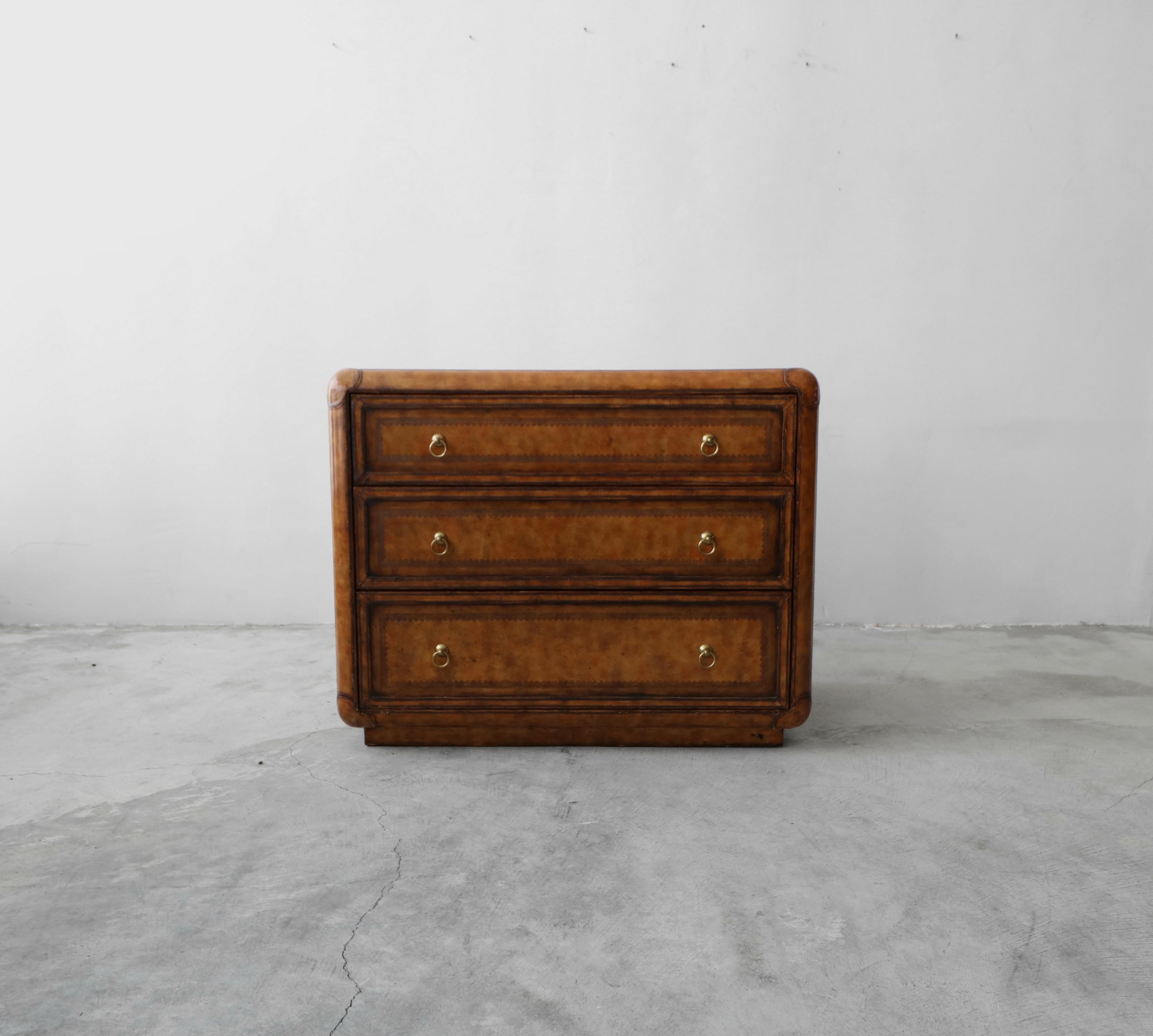 This gorgeous, leather covered chest is an exemplary example of Classic Maitland-Smith craftsmanship. Would make the perfect entry chest or men's dresser.

Chest is covered in beautifully patinaed leather, with hand tooled details and brass drawer
