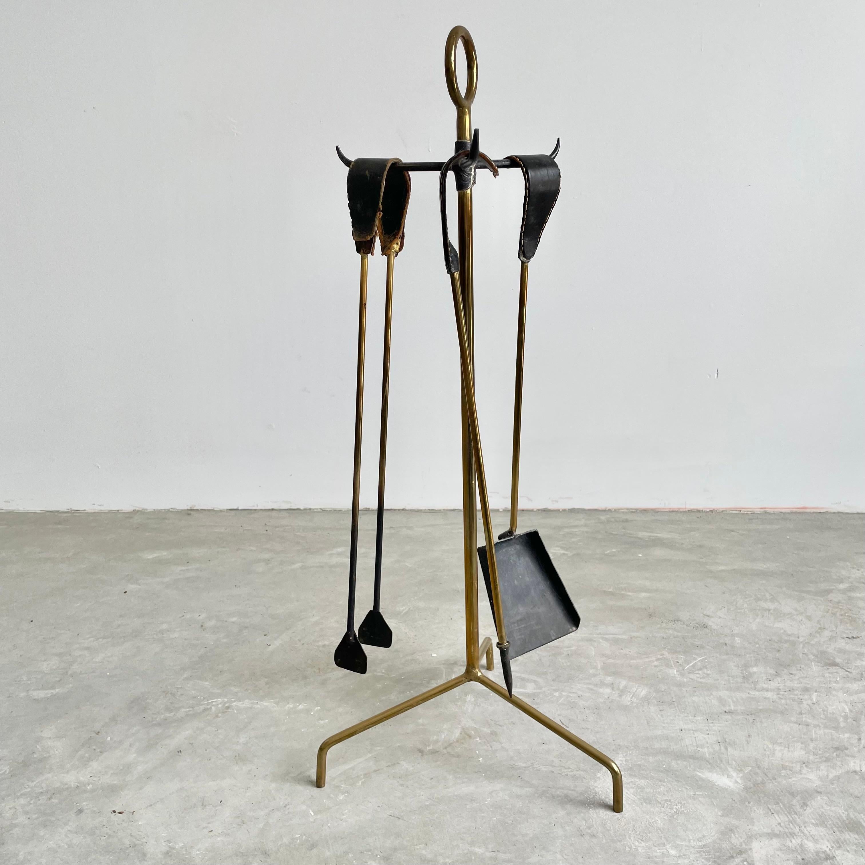 Iron Leather and Brass Fireplace Set by Jacques Adnet, 1950s France For Sale