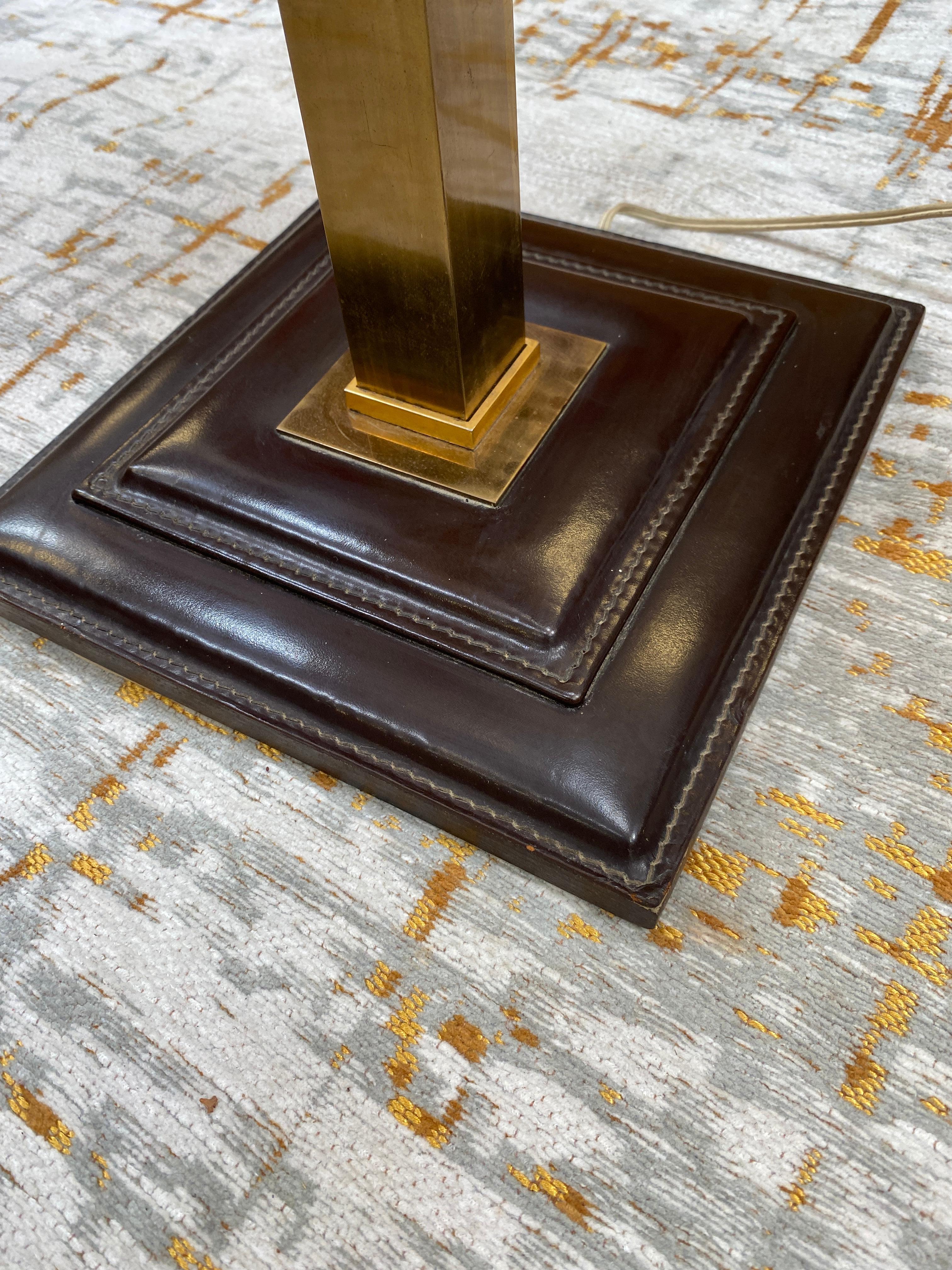 Leather and brass table lamp attributed to Jacques Adnet, circa 1950.