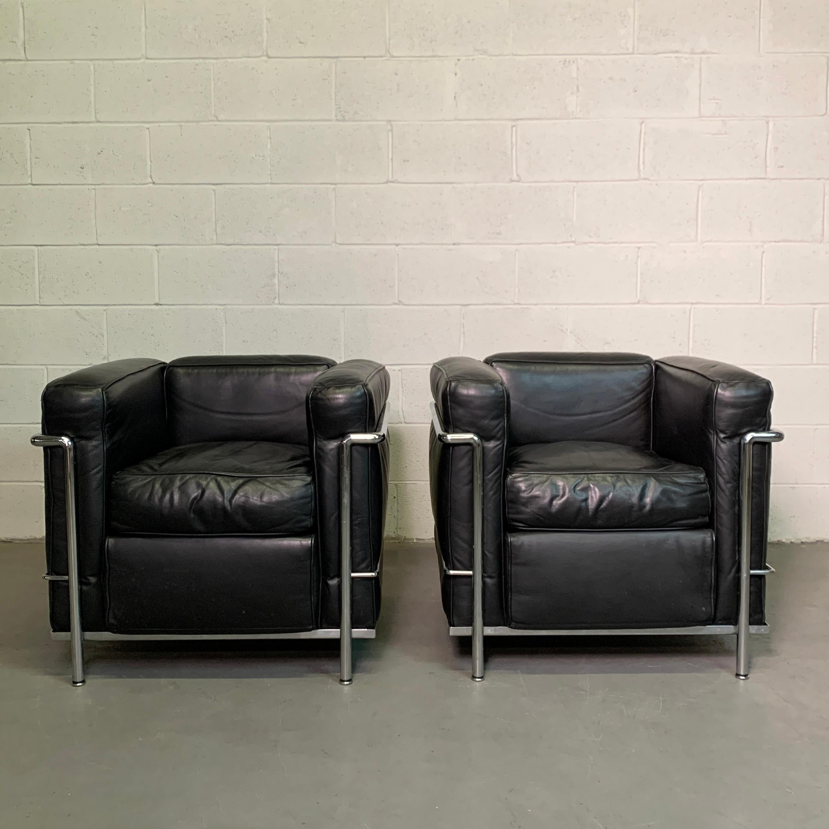 Classic, pair of LC2 club chairs designed by Le Corbusier, Charlotte Perriand and Pierre Jeanneret produced by Cassina, 1970s features black leather upholstery with a tubular chrome frame.