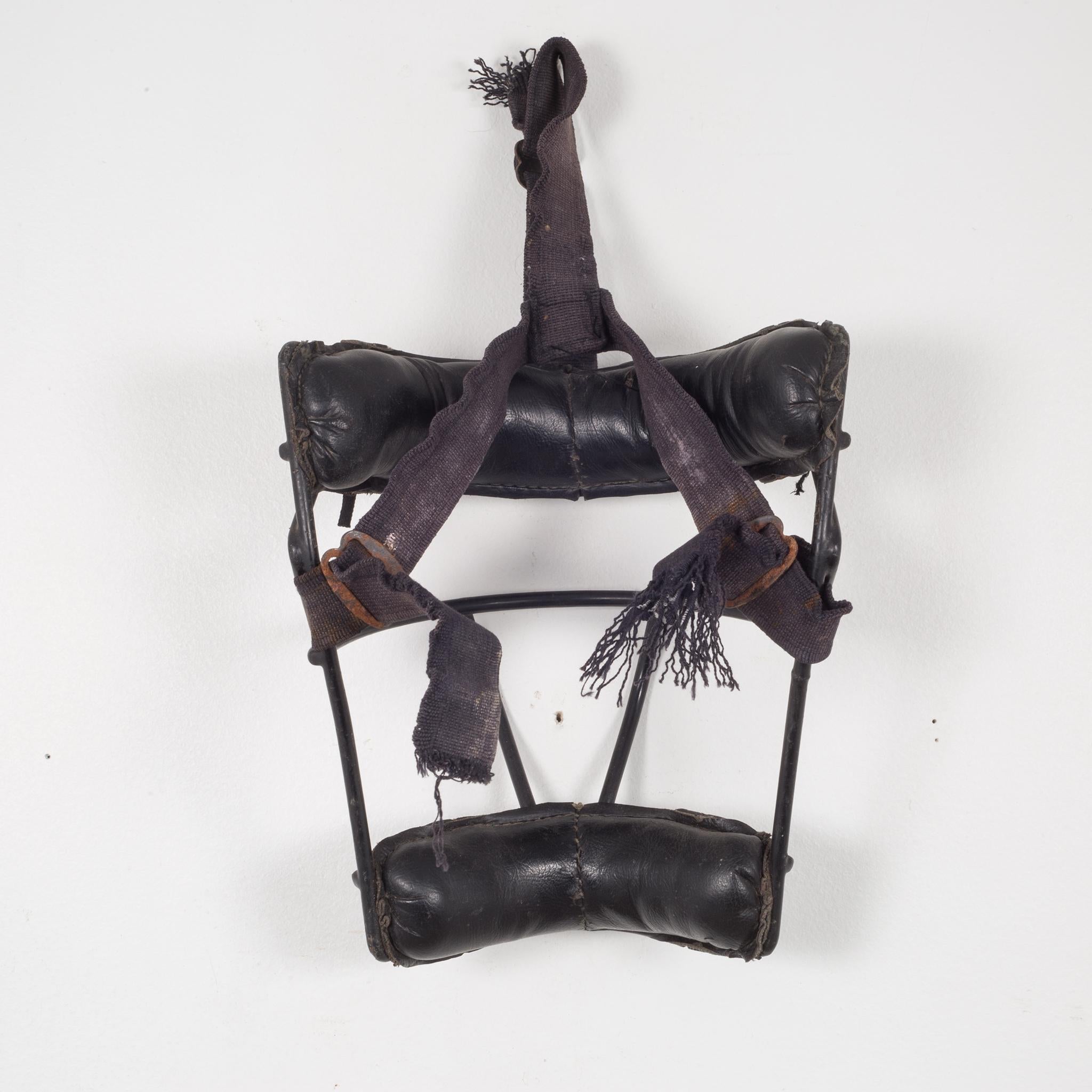 About

This is an original vintage catcher's mask. The main body is metal with thick leather padding. The piece has retained most of its original finish and is in good condition with appropriate patina for its age.

Creator: Unknown.
Date of