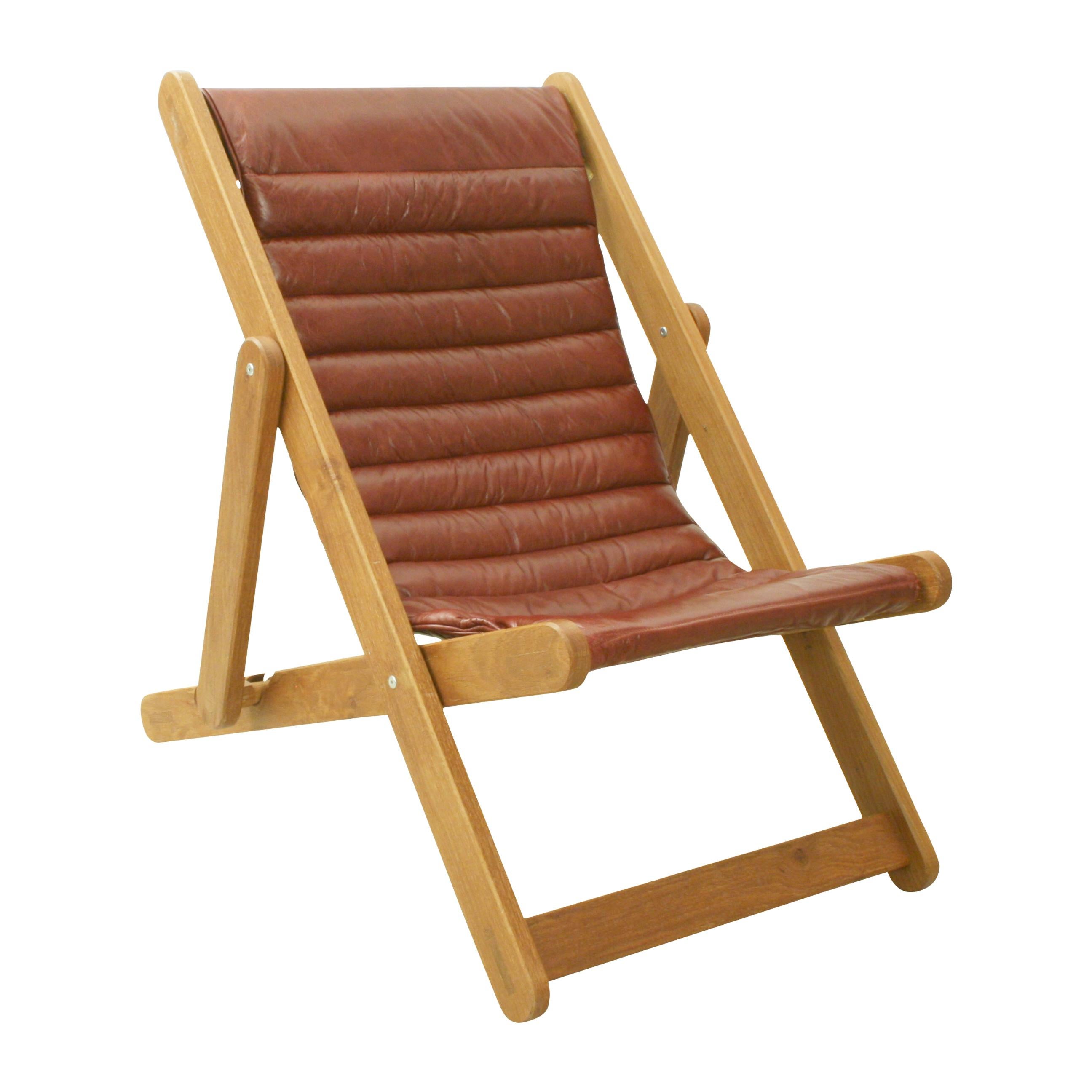 Modern Leather and Oak Deck Chair.
An extremely sturdy leather covered deck chair made with an oak frame. This is a heavy duty traditional design English deck chair with two seating positions. The chair is very comfortable as the red leather sling