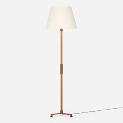 Lámpara de pie de cuero y roble de Jacques Adnet.