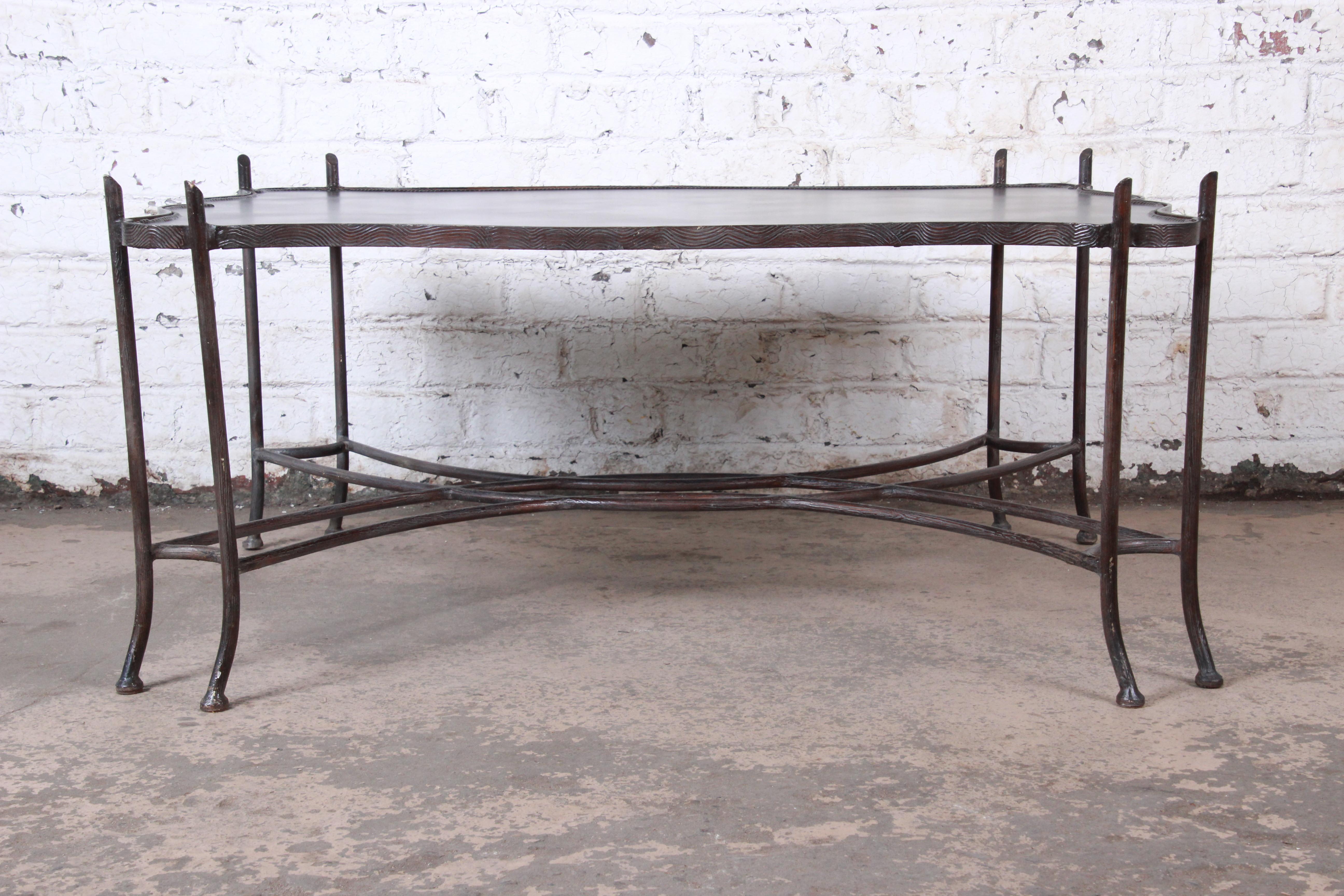A gorgeous coffee or cocktail table in sculptural forged steel and leather

By Sarreid Ltd.,

circa 1990s

Measures: 49