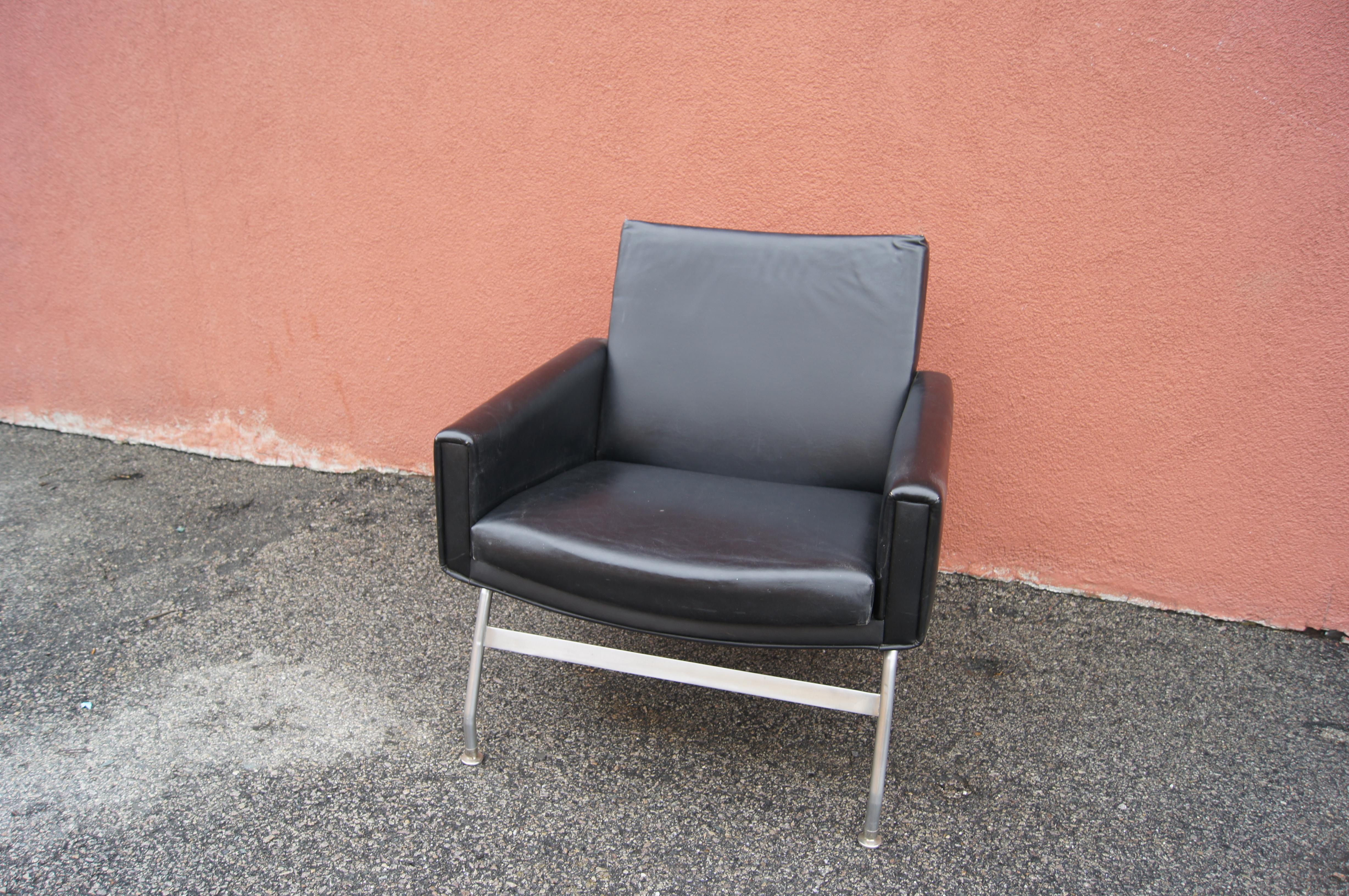 Manufactured in the late 1950s by Henry Rolschau Møbler in Vejen, this Danish modern leather armchair sits on a steel frame. Its upholstered seat, back, and arms are angled for comfort, creating a dynamic line.

Manufacturer's label underneath.