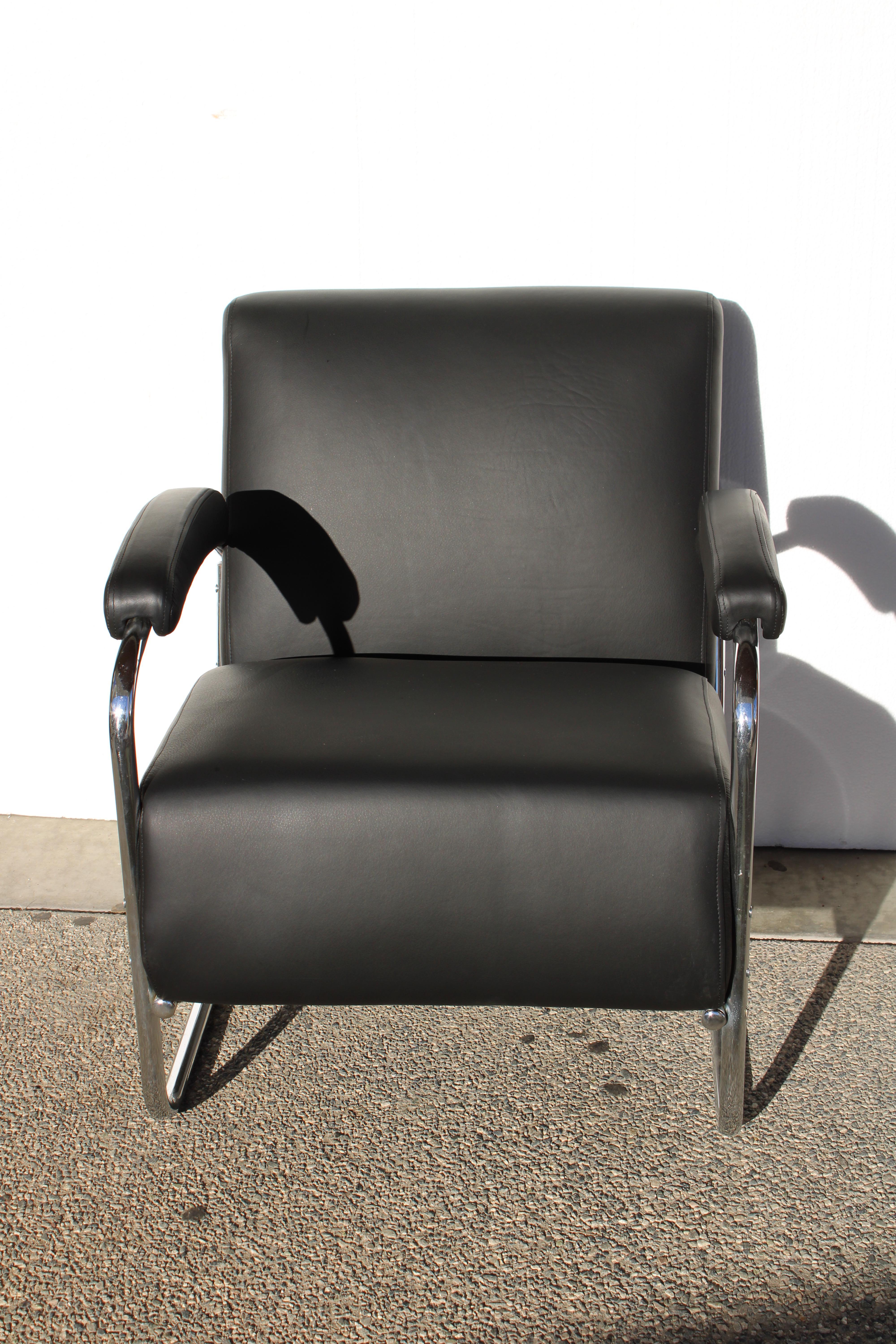 This lounge chair was originally a sofa designed by the Lloyd Manufactureing Company.  Due to the wear we decided to make it a comfortable lounge chair upholstered in black leather.  The steel chrome is all original.  The chair measures 27.5
