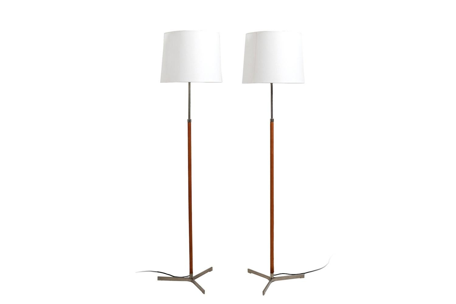 Pair of Jo Hammerborg „Monolit“ floor lamps with cognac leather and steel. New shades and cable.(the old cables was damage.)  Fog & Mørup Denmark, 1960s. Rarely offered model. price for the pair.