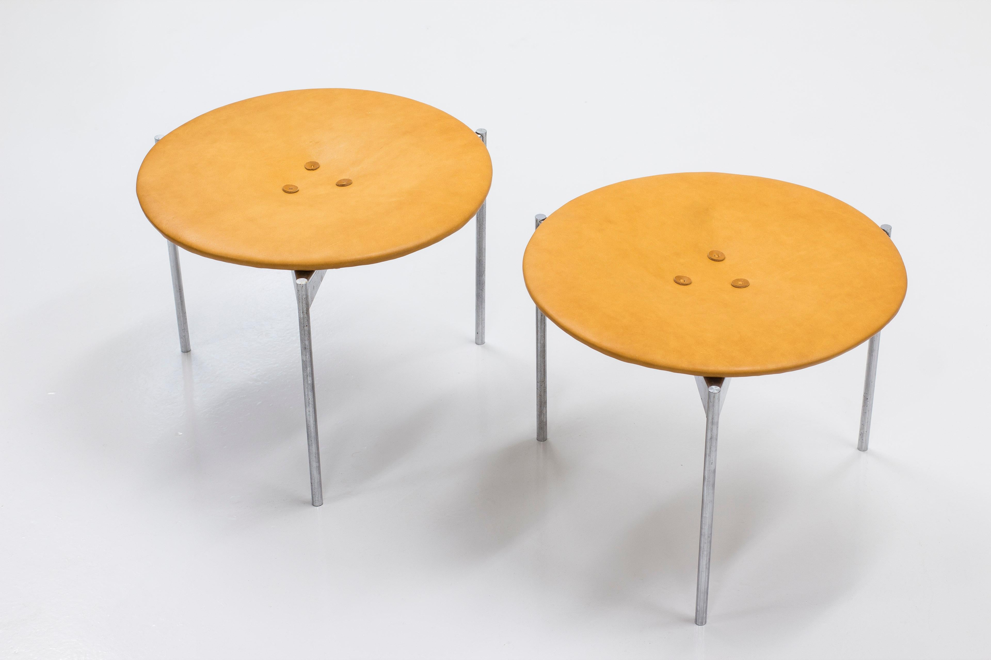 Rare pair of stools designed by Uno & Östen Kristiansson. Produced in Sweden by Luxus during the 1960s. Stainless steel legs and seats reupholstered in vegetable cognac leather. Very good vintage condition with few signs of wear and light patina.