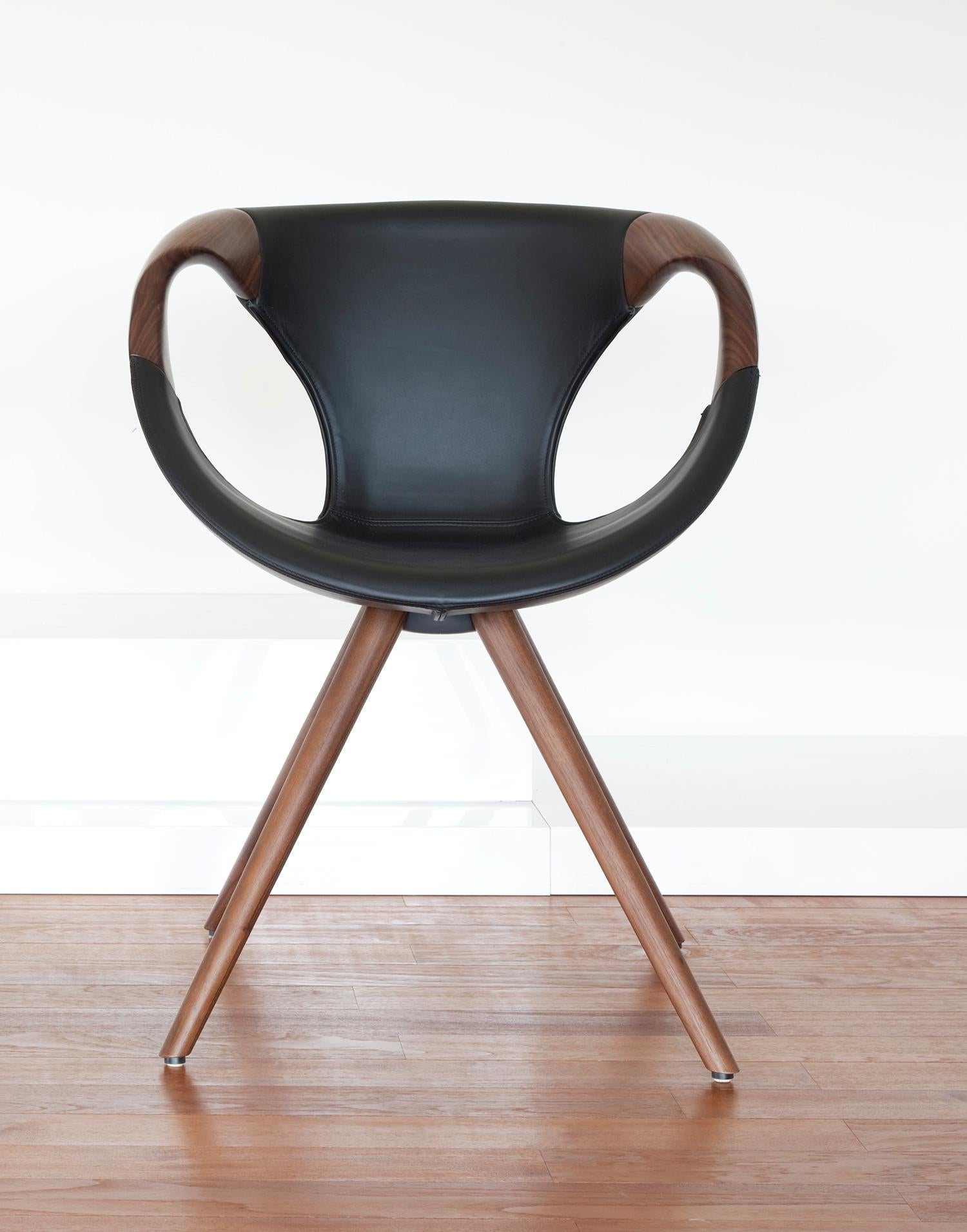 The Up chair with unique flowing wood arms by Tonon is an highly chair. For this version of the popular Up chair you can choose between wood legs and arms in either oak or walnut.
The seat of the chair is upholstered in soft Italian leather in