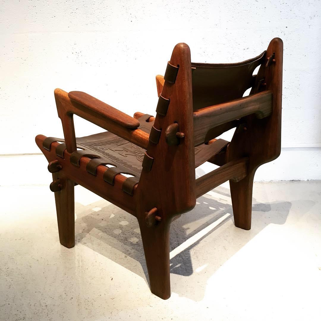 Leather Angel Pazmino 's armchair for Muebles De Estilo circa 1960 Ecuador.
This vintage armchair feature tooled leather Incan motifs. These chairs were designed as a result of a Peace Corps project with the USAIDepth to aid South American