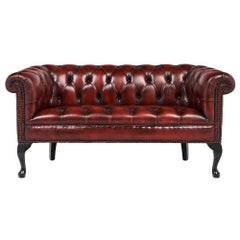 Causeuse Chesterfield ancienne en cuir