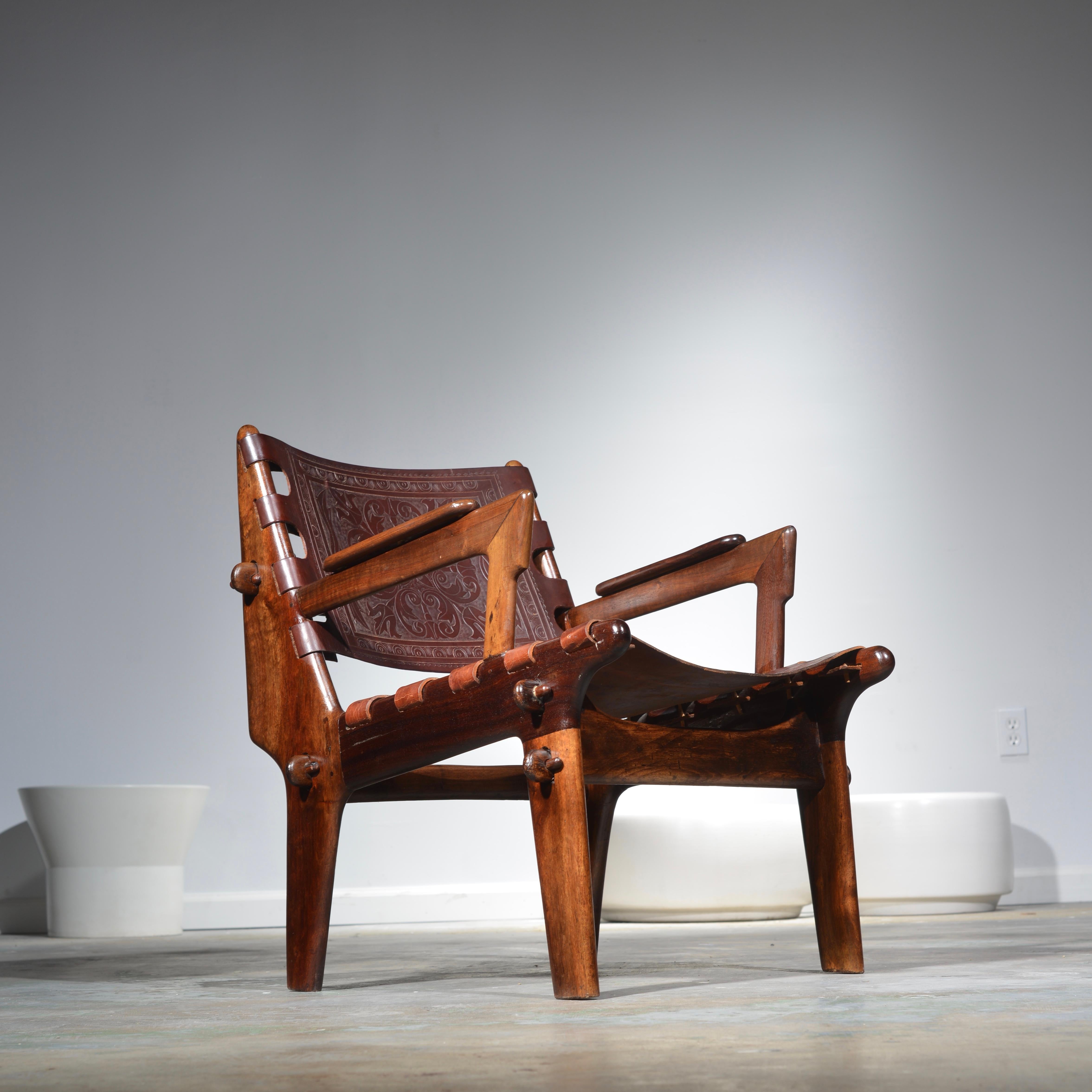 Rosewood and leather armchair by Angel Pazmino for Muebles De Estilo circa 1960 Ecuador. This chair is in original condition.